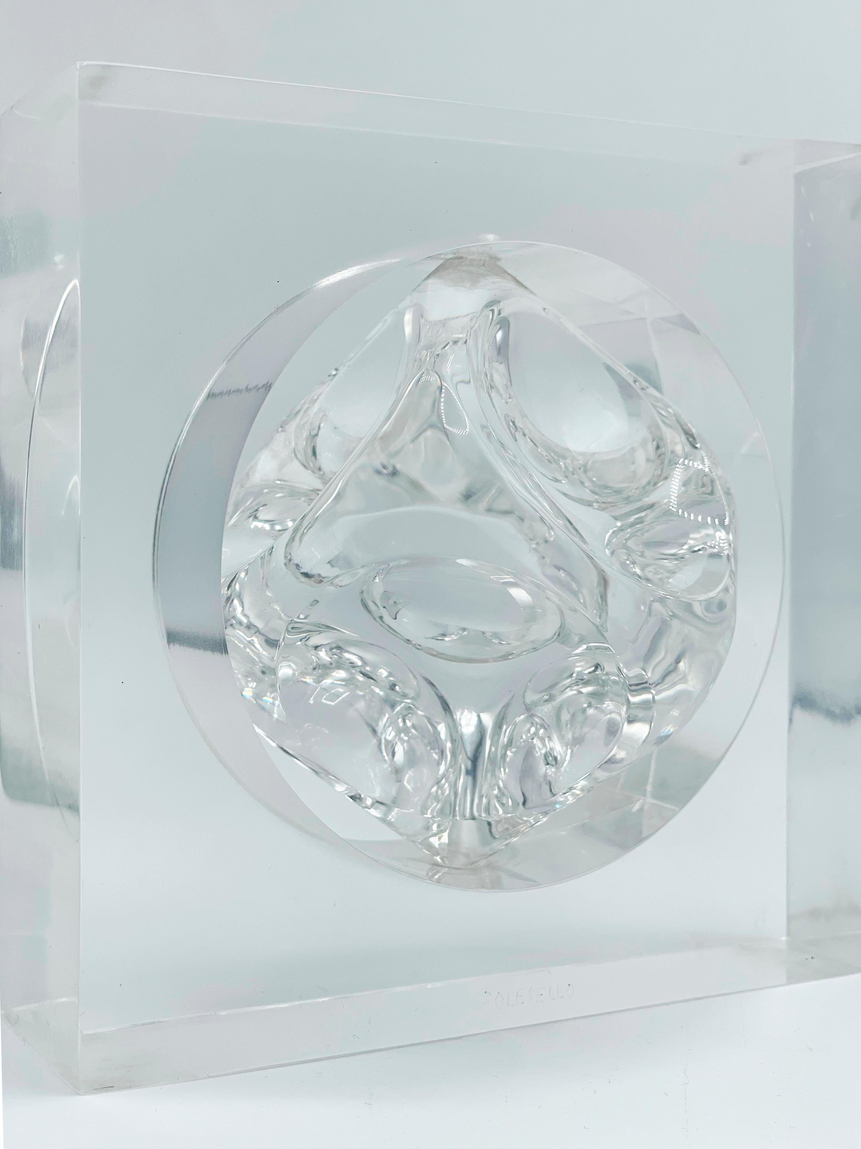 Transparent acrylic sculpture by Rogelio Polesello, with a moving cubic center. This particular piece plays with optical illusion due to transparency and light bounces.
A little about Polesello:
Polesello's works combine geometric shapes with