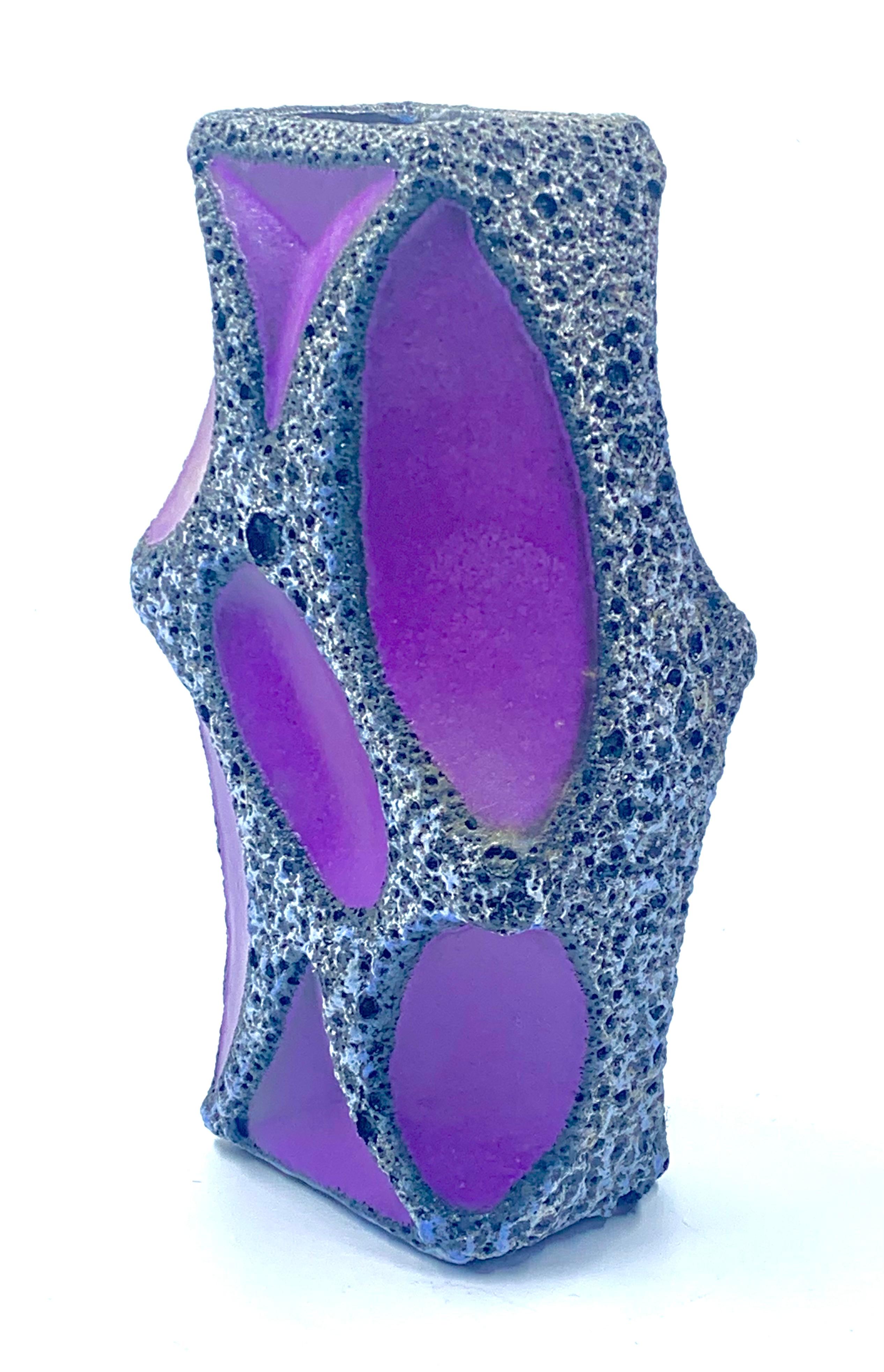 A Roth Keramik rare purple panelled large vase with white and black lava glazed borders with a blue rim.
Pattern number 311.
This shape came in two sizes, this being the largest.
In excellent condition with some crazing to the purple glaze which in