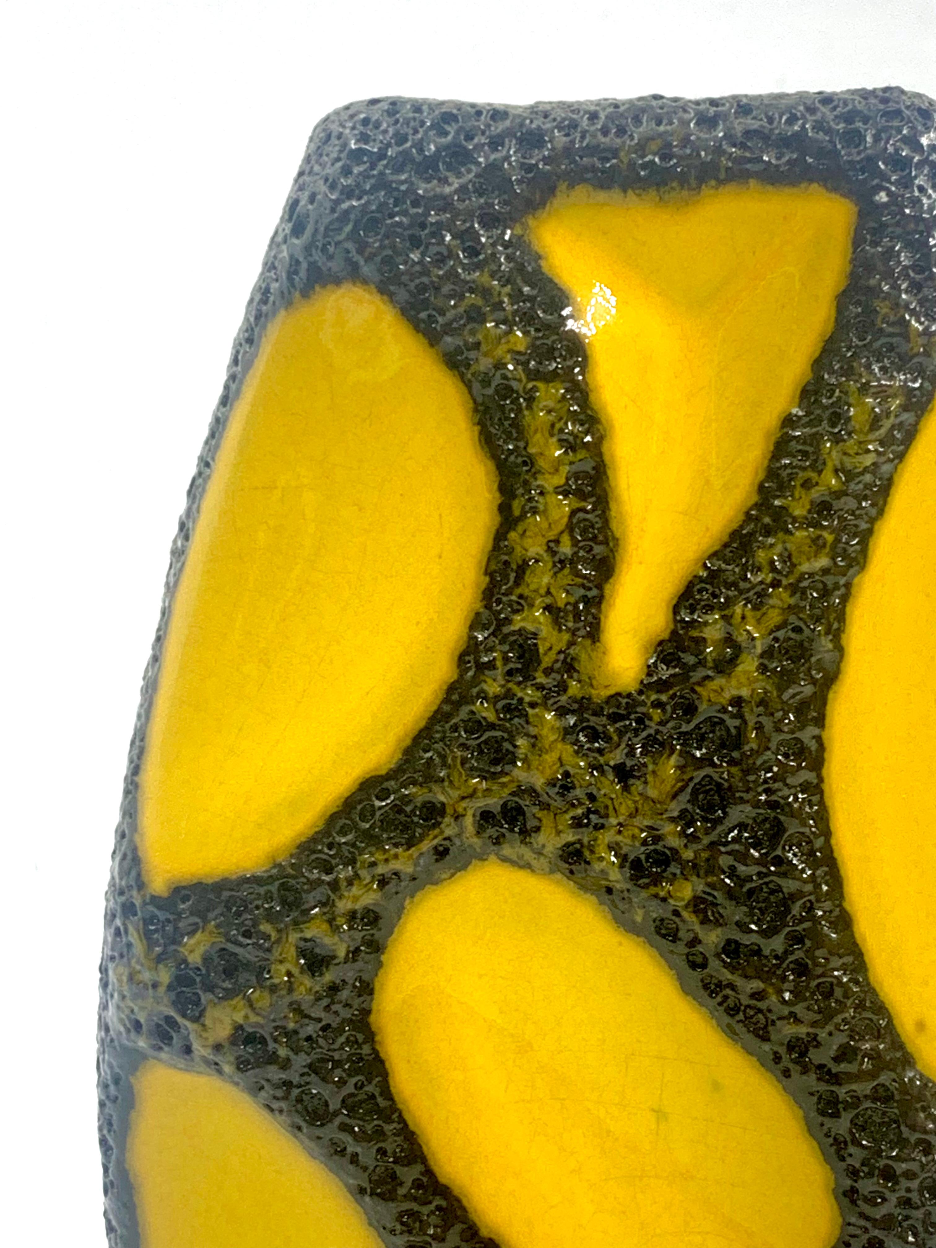 A very, very rare yellow panelled small vase with glossy black lava glazed borders to the panels, pattern number 309.
This vase comes in two sizes, of which this the smallest.
In excellent condition from the 1960’s-70’s.