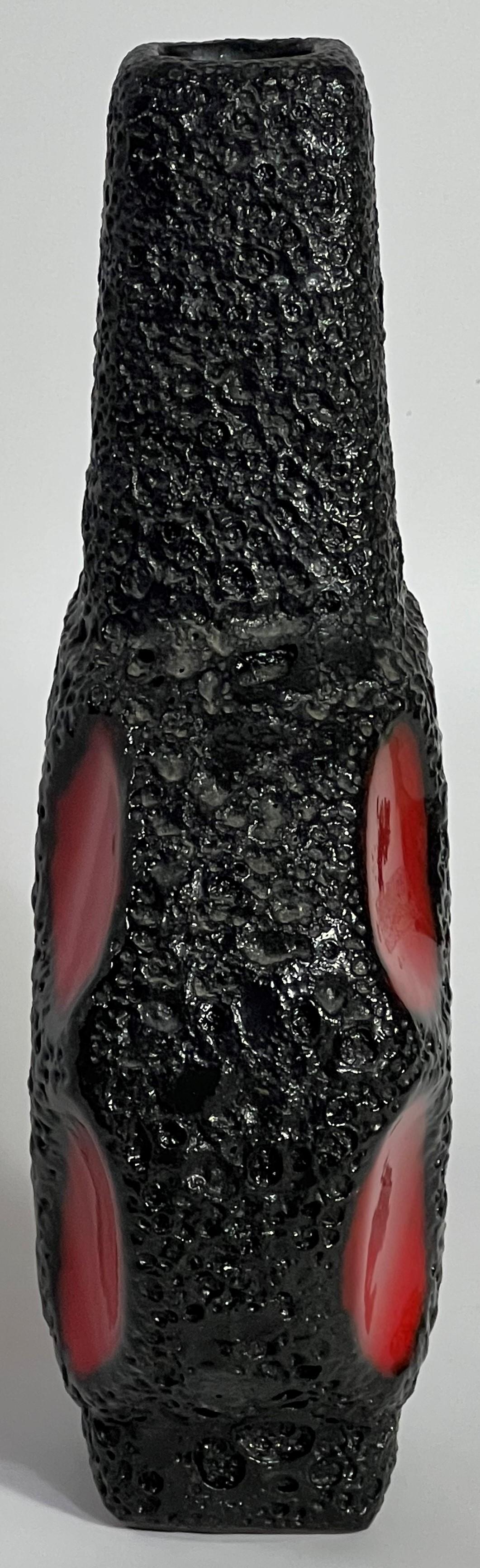 The banjo vase from Roth Keramik is among the most collected Fat Lava pottery forms. And, this bright red and black volcanic is stunning. The rich glaze complements the dark brick red clay to extraordinary effect. The banjo is a feature of many mid