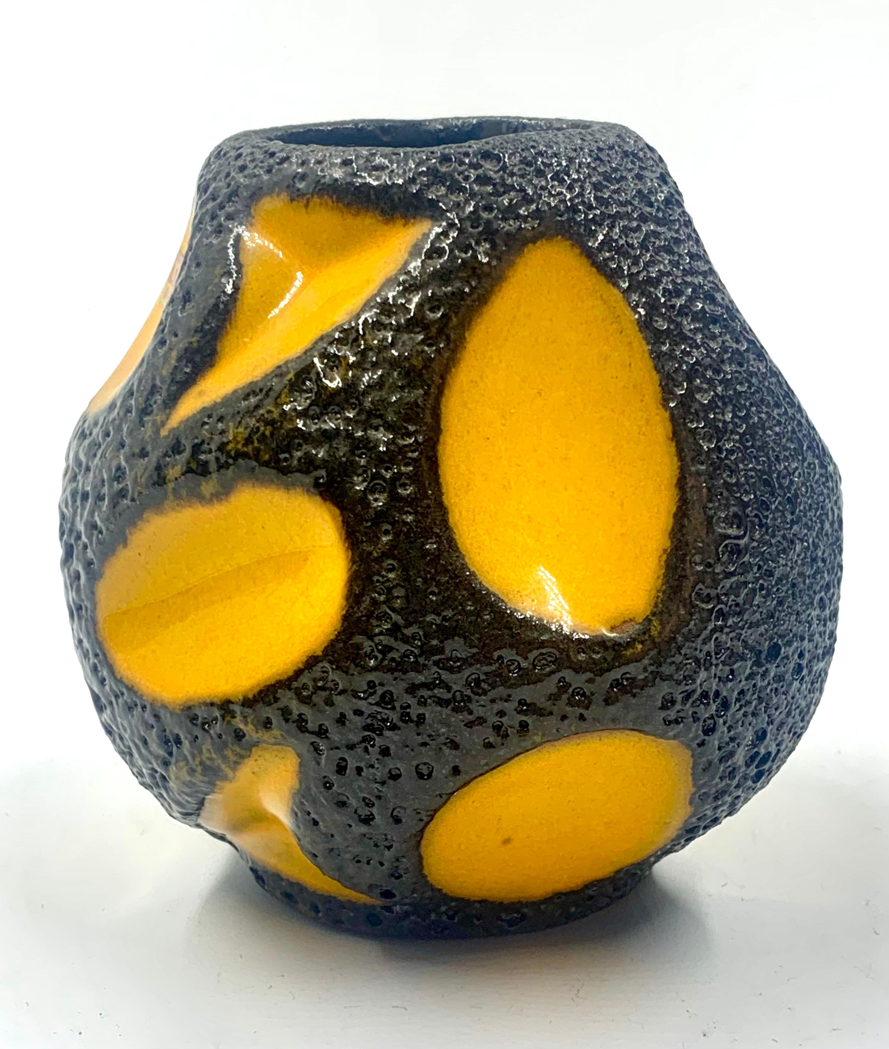 A very rare Roth Keramik yellow and black ball vase in excellent condition.
Pattern number 308, retains the manufacturer’s label from c.1970.
A lovely glossy and vibrant piece.