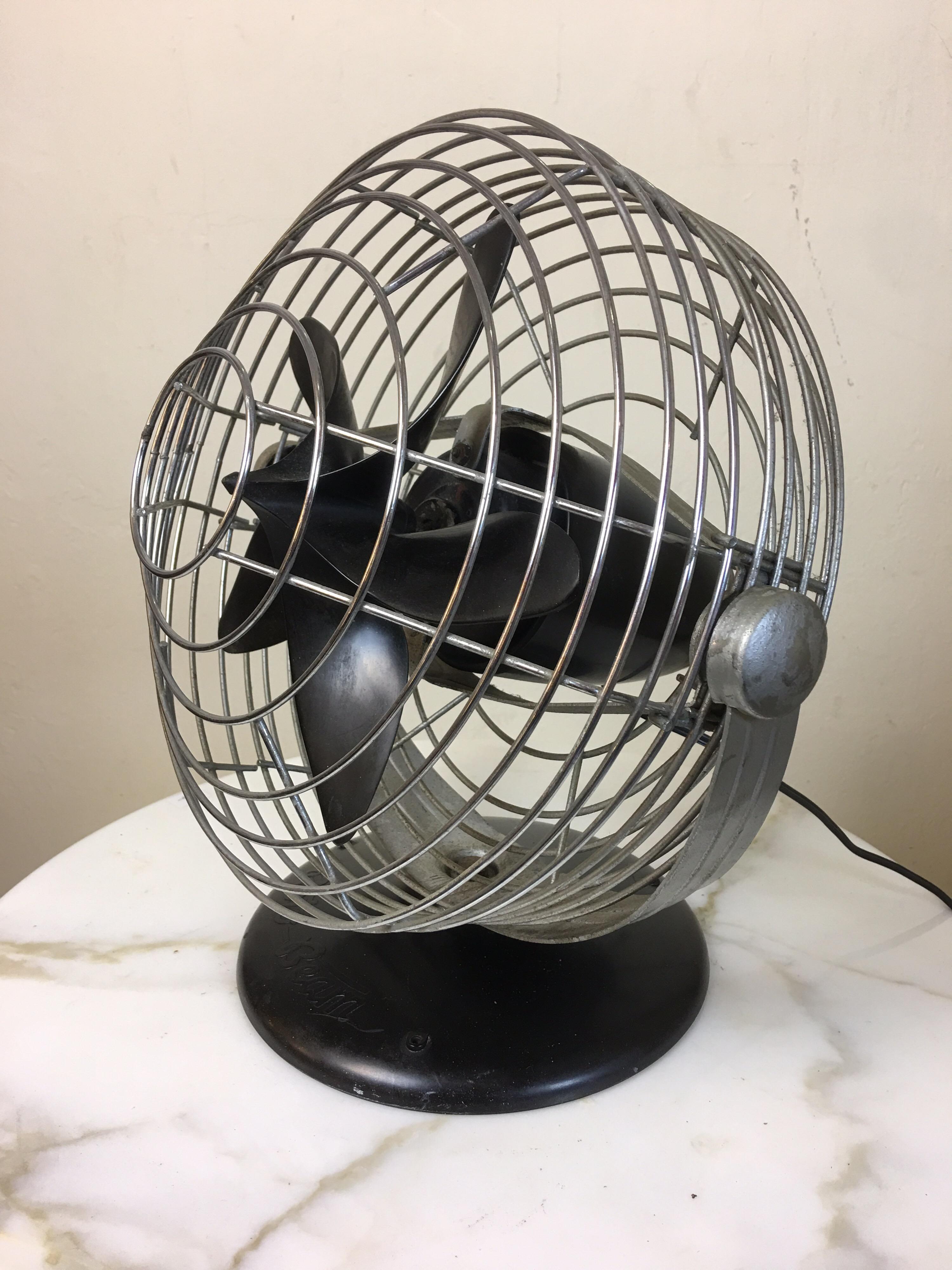 Roto beam Machine Age table fan designed by Max Weber. Unique Bakelite base and blade gives this fan a great look! Pull chain switch located at the back of motor. As quiet as a fan can be.  Original design was patented in 1937, this model is from