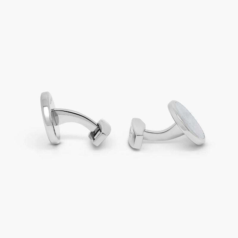 Rotondo Guilloché cufflinks with white mother of pearl in stainless steel

Inspired by the Guilloche pattern used in classical Greek and Roman Architecture. This decorative technique of engraving is enhanced when decorated on a disc of white mother