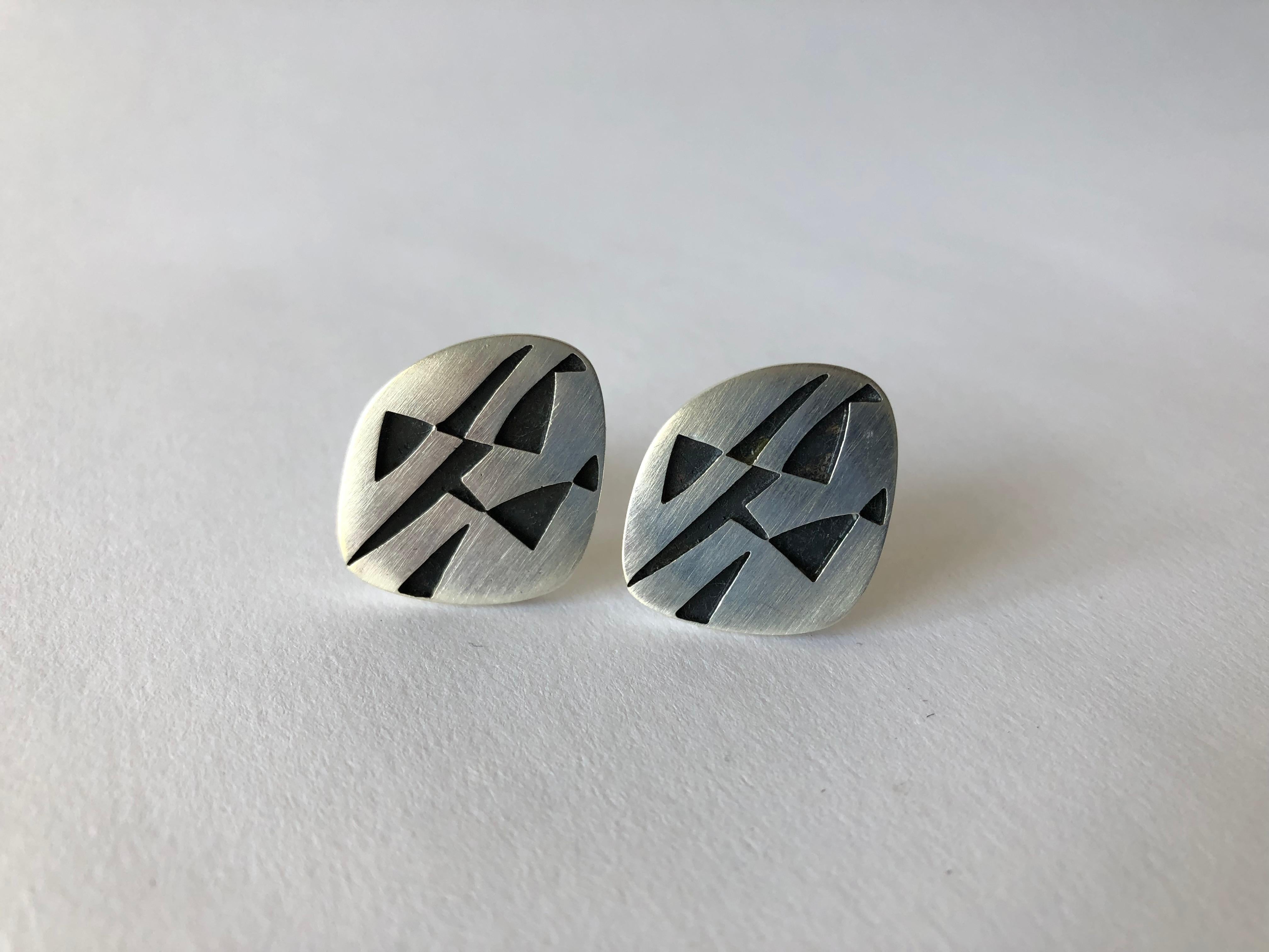 Large scale brushed sterling silver cufflinks with cut out geometric design created by Rotter, circa 1960.  Cufflinks measure 1.25