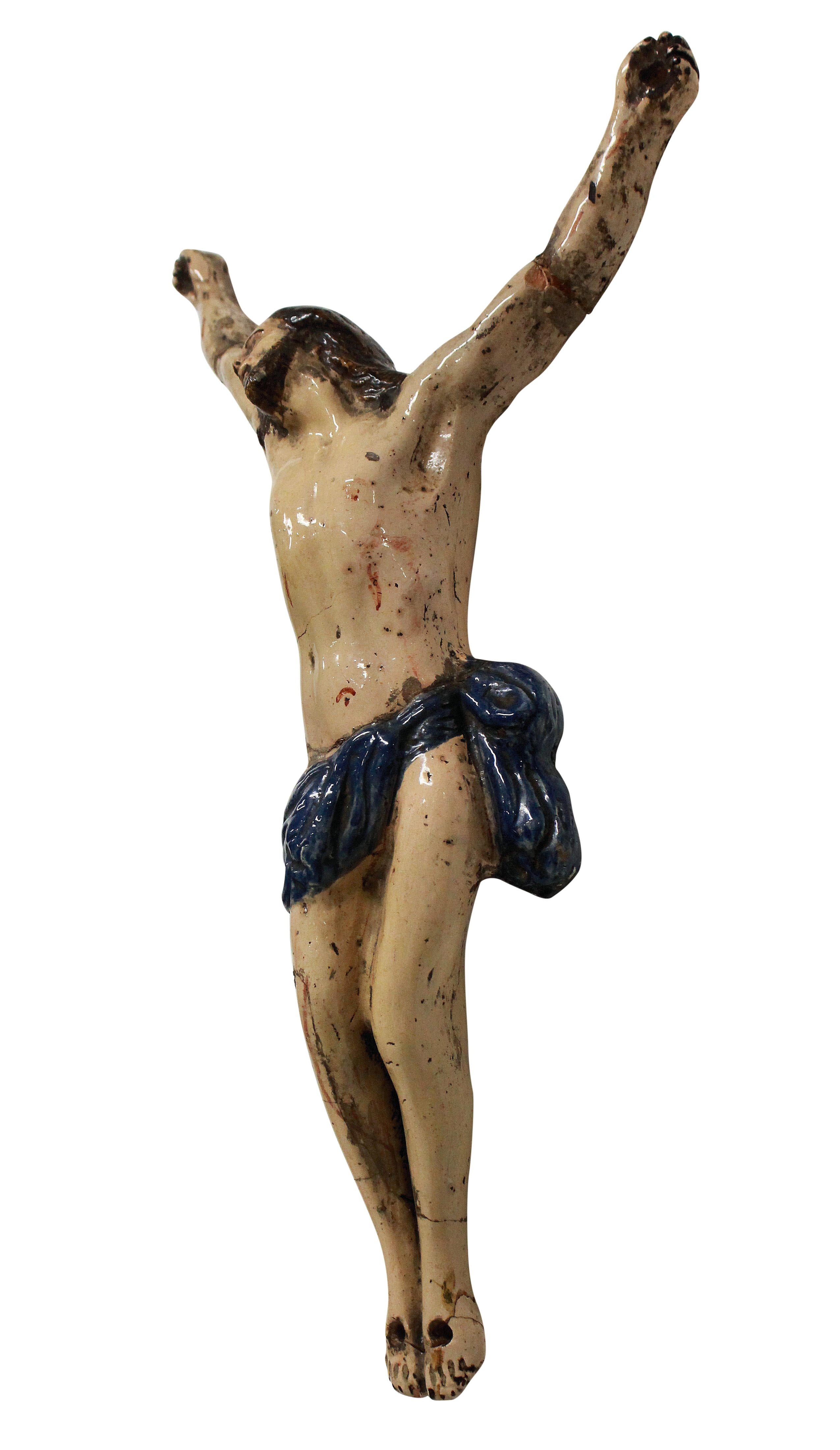 A French faience corpus manufactured in Rouen. The cross now missing and with historic damage to the wrists and ankles.
