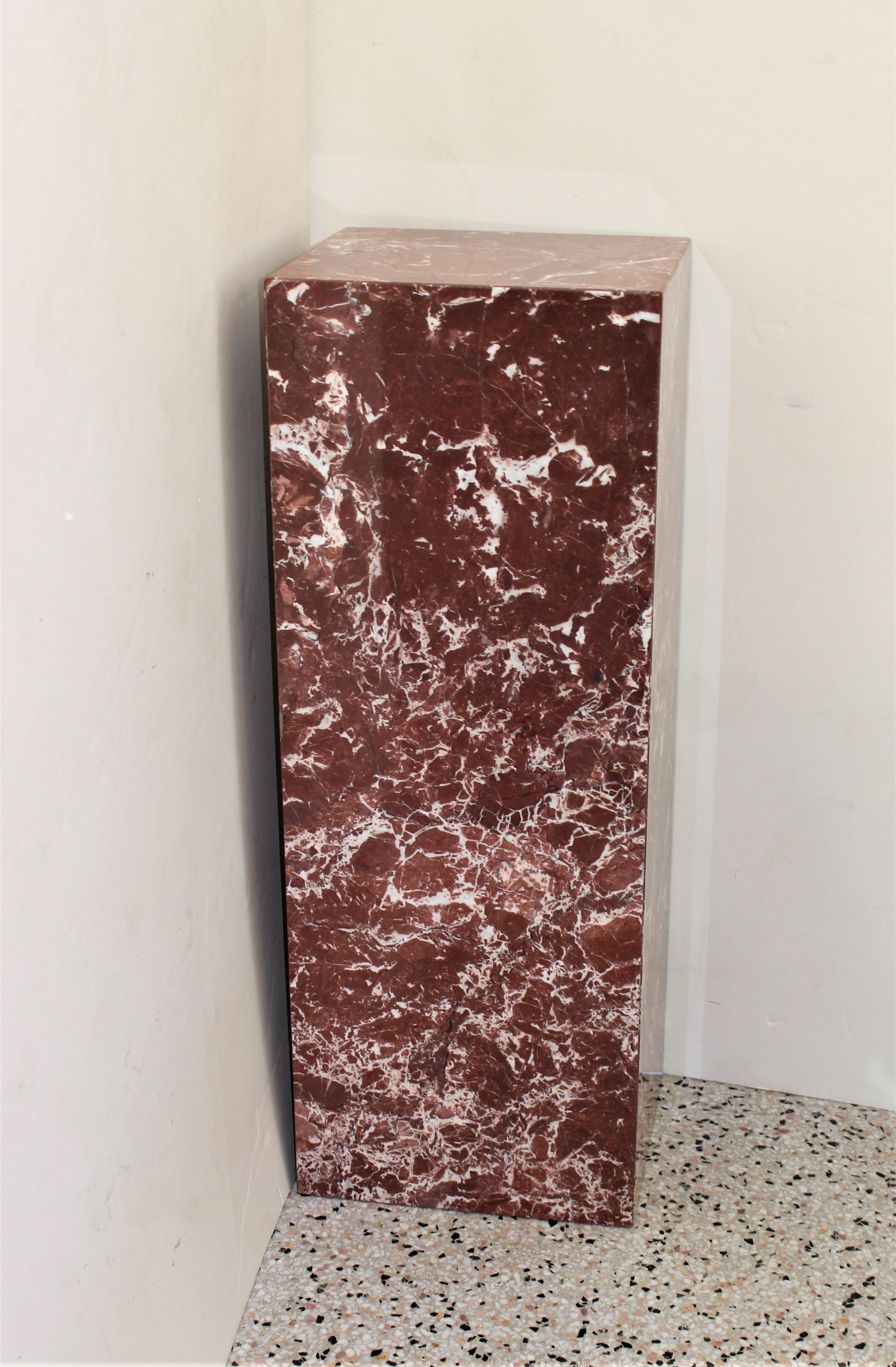 This rectangular rouge colored marble pedestal is definitely makes a statement with its strong form and soft coloration.

 