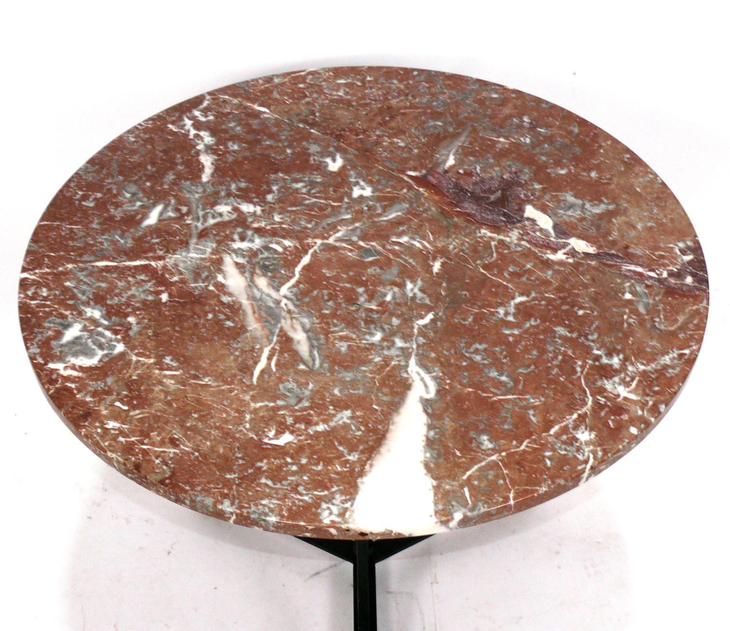Elegant Rouge Marble and Iron Breakfast or Petite Dining Table, Italian, circa 1950s. It measures 35.25