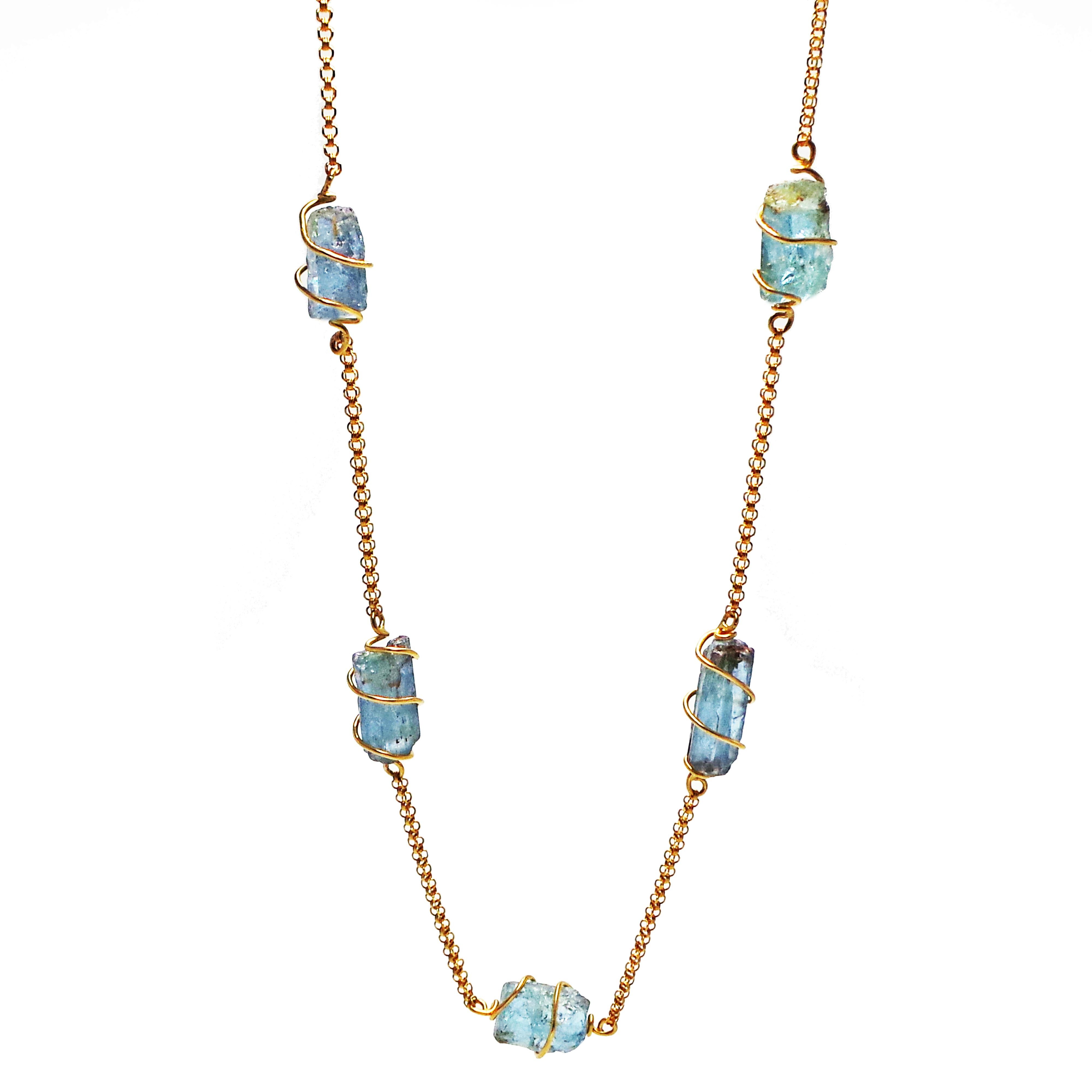 Seven rough Aquamarine gemstones wrapped in 22k yellow gold wire and connected with solid 22k yellow gold Rolo chain. This chain link necklace is finished with a hand-forged, 22k yellow gold 