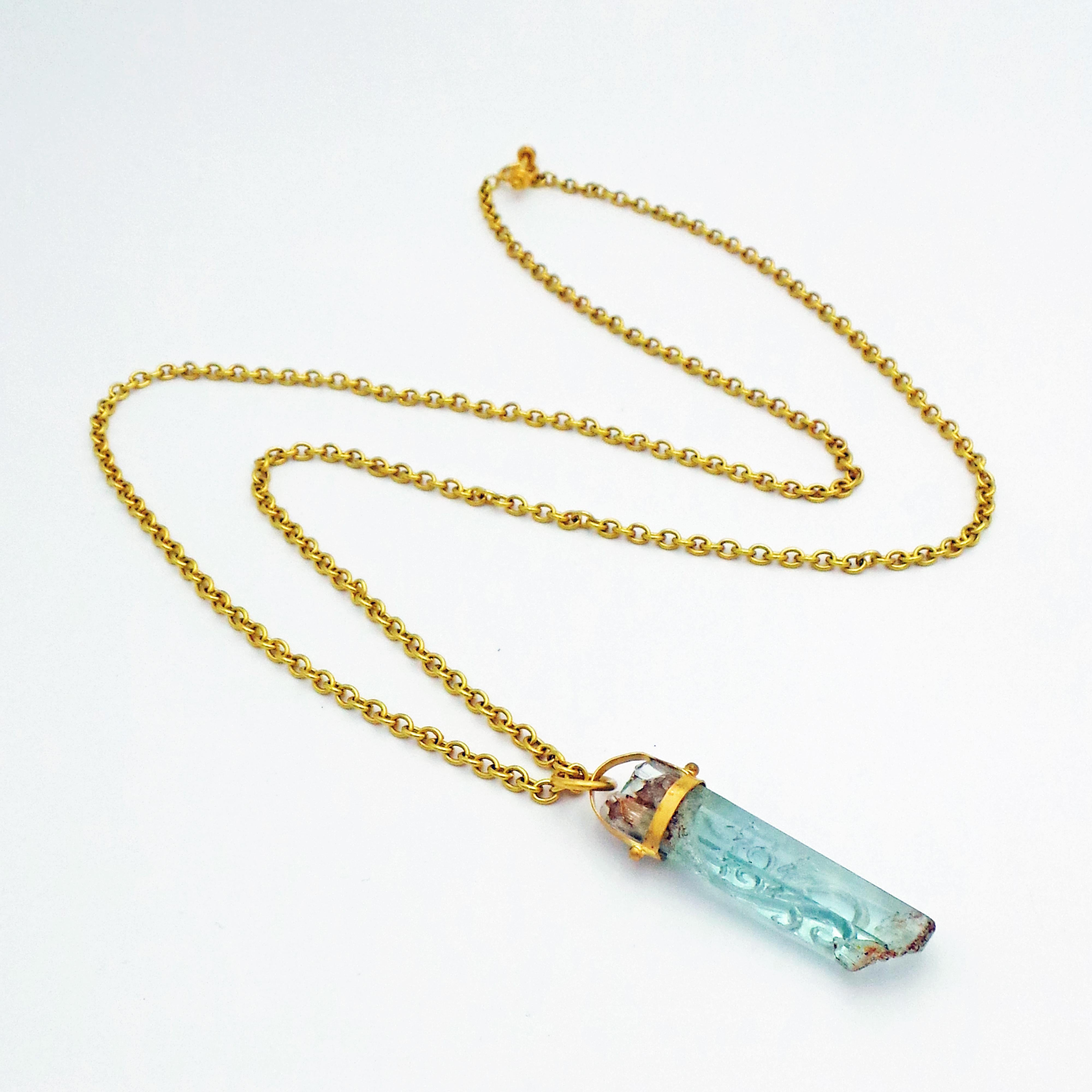 gold chain with crystal pendant