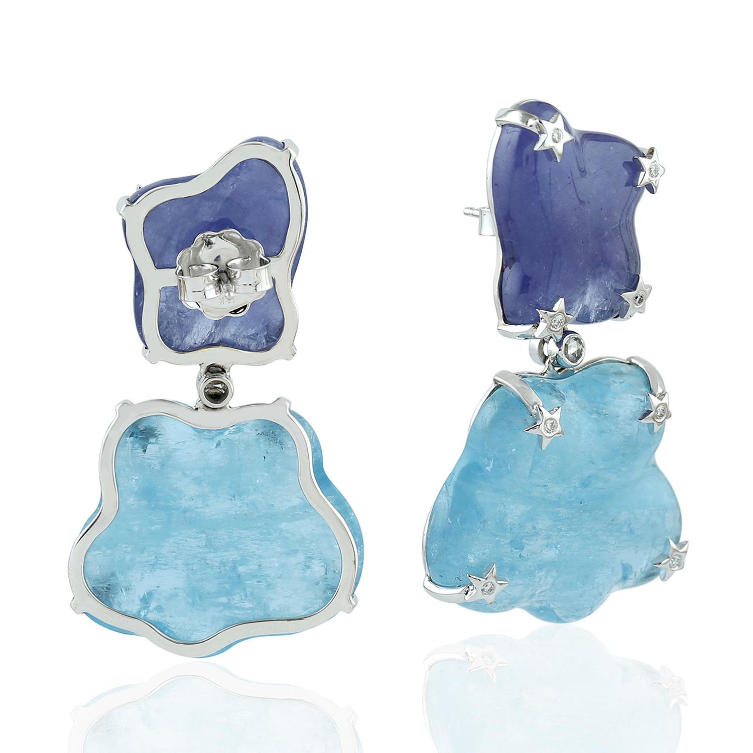 One of a kind this free-form Aquamarine & Tanzanite Earring in 18K white gold with star diamond motifs is like carrying those clouds around you. It's just majestic.

18KT: 11.655gms
Dimond:0.25cts
AQUMARINE: 54.97cts
TANZANITE: 53.76cts