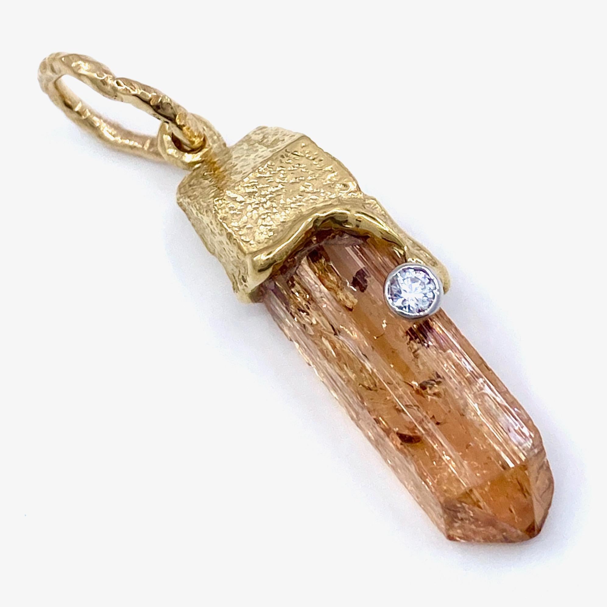 Eytan Brandes has had this citrine prism for years.  It's a beautiful crystal, filled with all kinds of natural inclusions, bubbles and fracture lines.  Because it has so many flaws, this citrine never had a shot at being a cut gem, but its