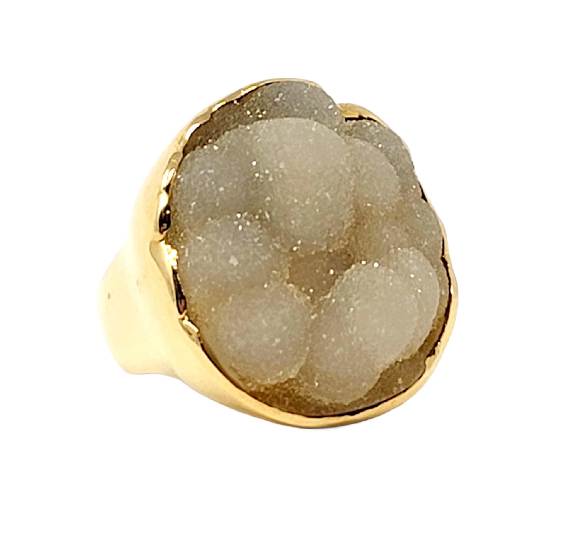 Ring size: 6.75

This huge natural agate cocktail ring makes an absolutely sensational statement. Substantial in both size and design, this ring will not go unnoticed! The center of the piece features a large, rough cut cluster of botryoidal agate