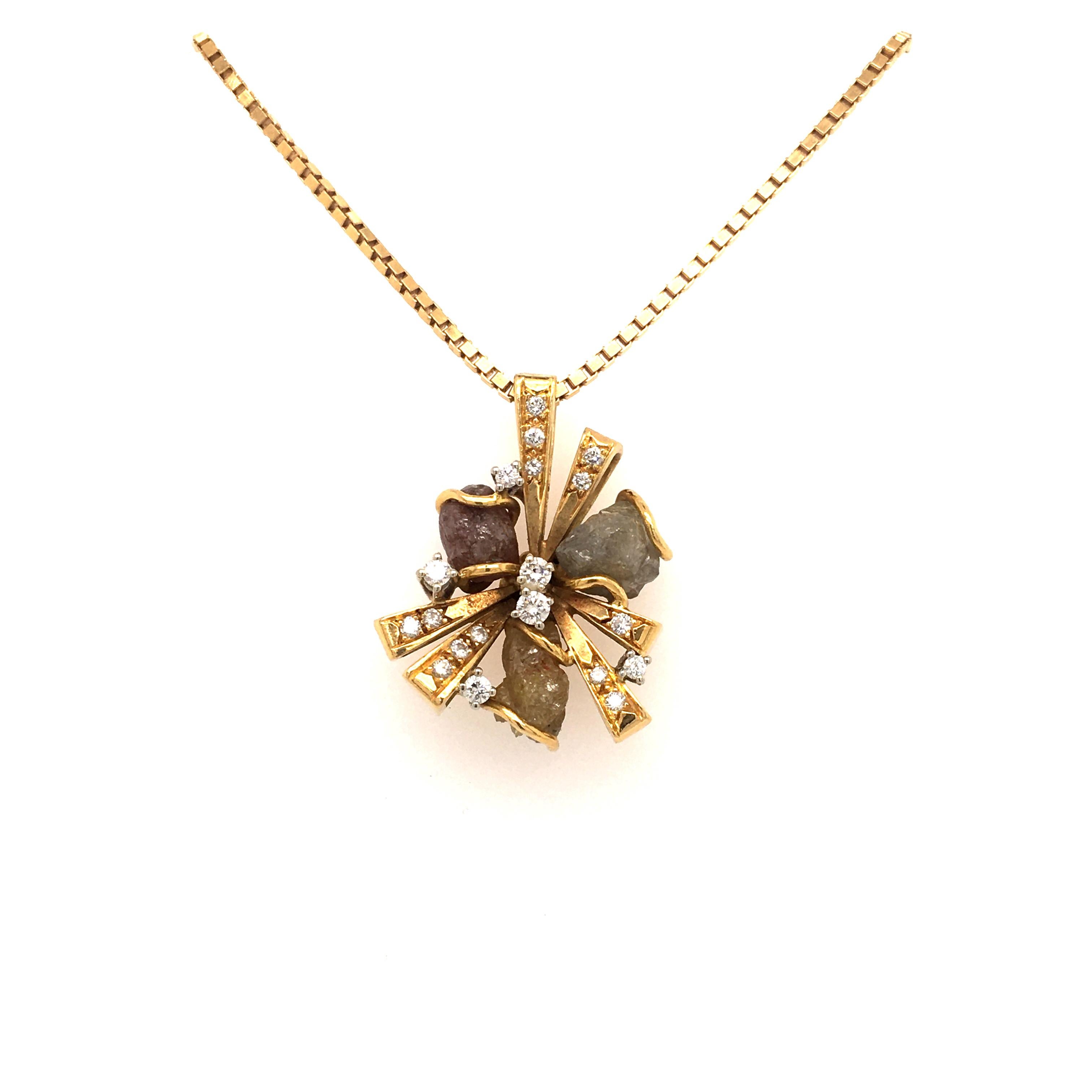 This exceptional pendant is made of 18k white and yellow gold. Set with 3 rough diamonds, in a brownish, grayish and yellowish tone. The 19 brilliant cut diamonds are totalling 0.30 ct with G/H-vs Quality. 

we have some more jewels with rough