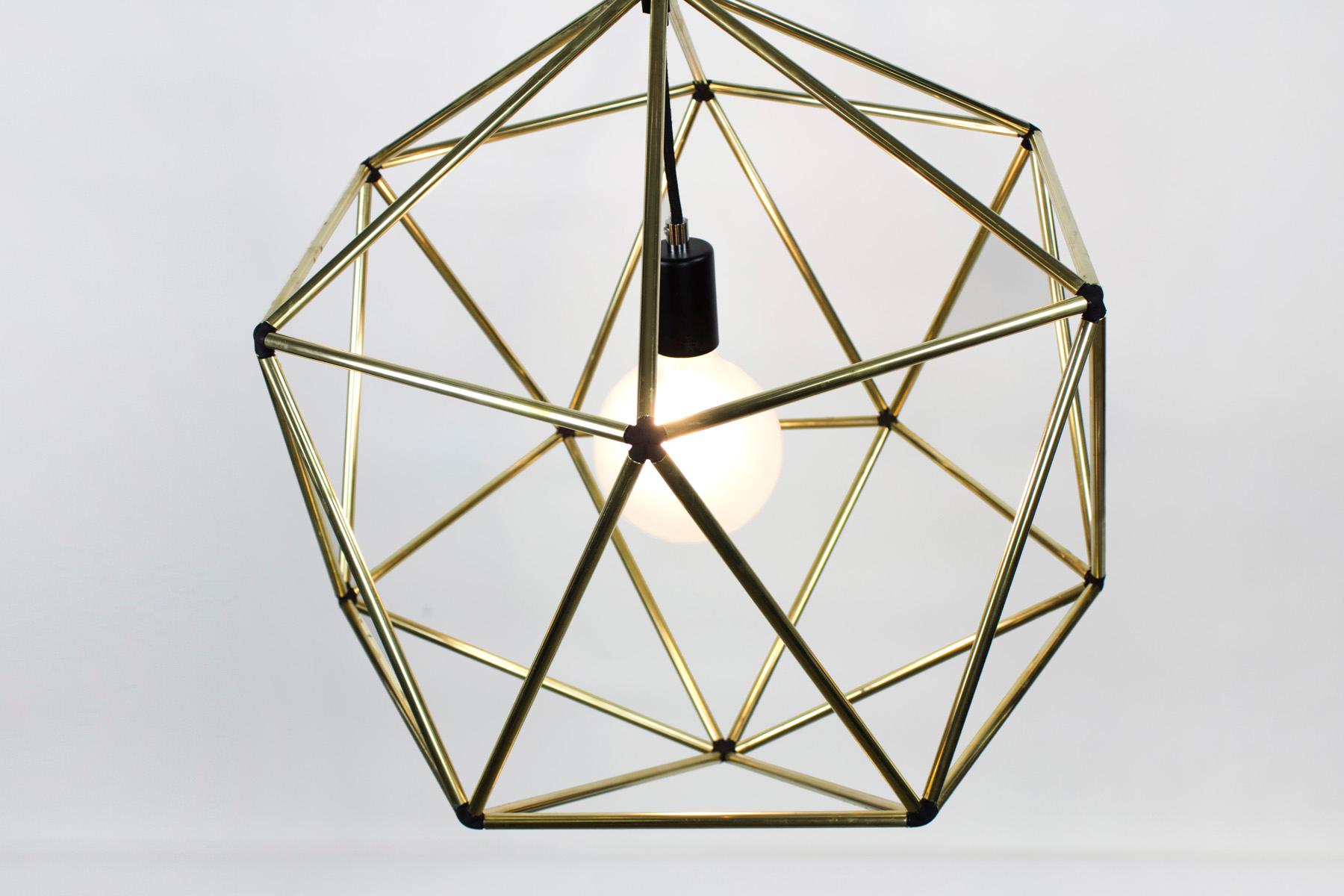 Rough diamond pendant is a decorative fixture that combines handmade craftsmanship with digital technology. The design combines a 3D printed joining system with handcut and assembled copper or brass tube. The result is a decorative feature light