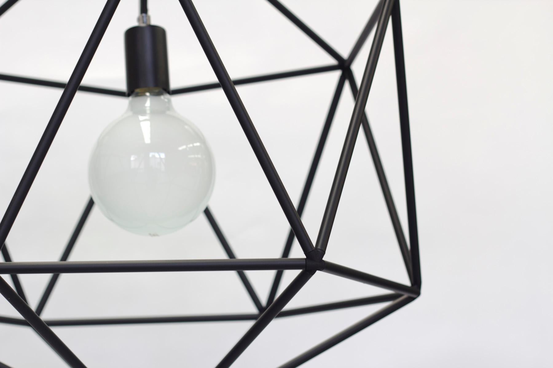Rough diamond pendant is a decorative fixture that combines handmade craftsmanship with digital technology. The design combines a 3D printed joining system with handcut and assembled copper or brass tube. The result is a decorative feature light
