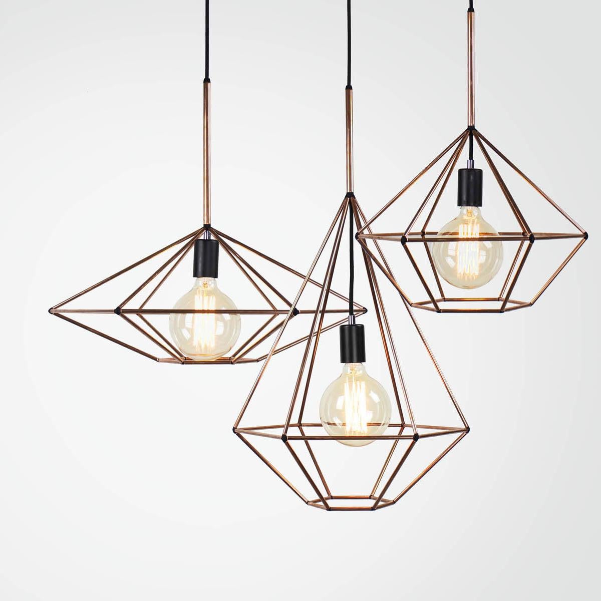 Rough diamond pendant is a decorative fixture that combines handmade craftsmanship with digital technology. The design combines a 3D printed joining system with hand cut and assembled copper or brass tube. The result is a decorative feature light