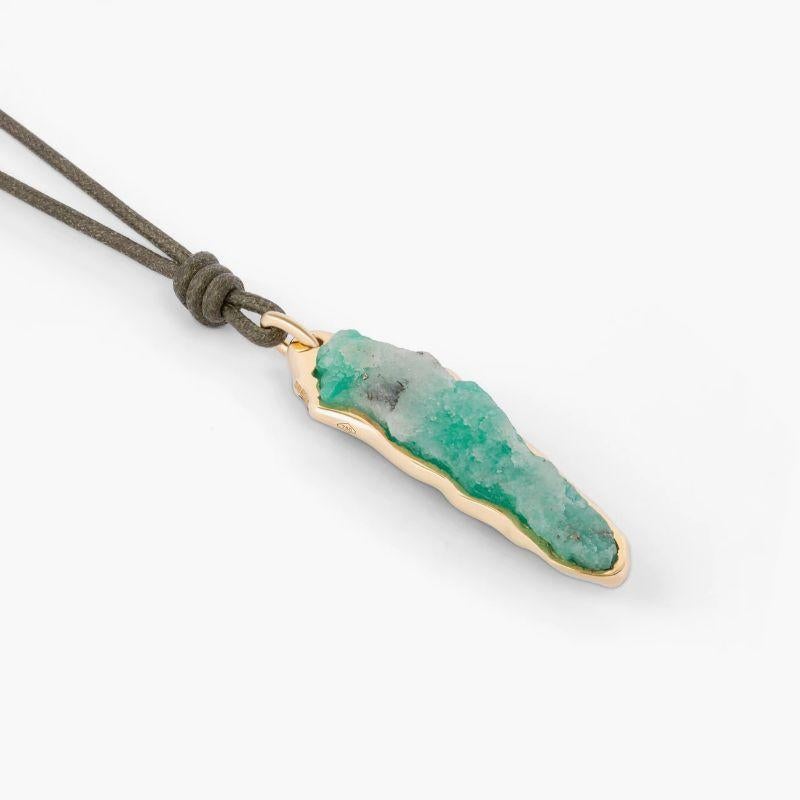 Rough Emerald (35.40ct) Pendant in 18k Yellow Gold

A magnificent rough emerald, sourced from Colombia, is placed within a melted bezel setting, allowing the raw and organic beauty of the stone to be admired from nearly all angles. The 18k yellow
