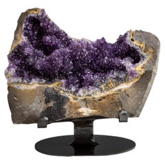 Rough geode section with contrasting amethyst