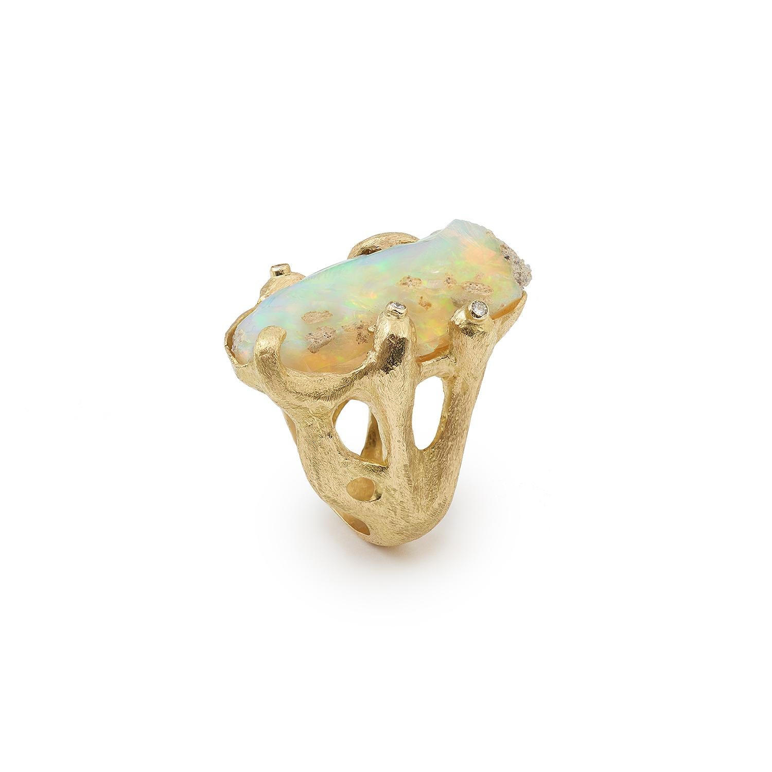 Custom Made One of a kind ring by Les Pierres de Julie.

Ring set with rough Ethiopian opal, three brilliant-cut diamonds and one baguette-cut diamond.

18-carat frosted yellow gold, 750 / 1000th (eagle's head hallmark)

One of a kind piece