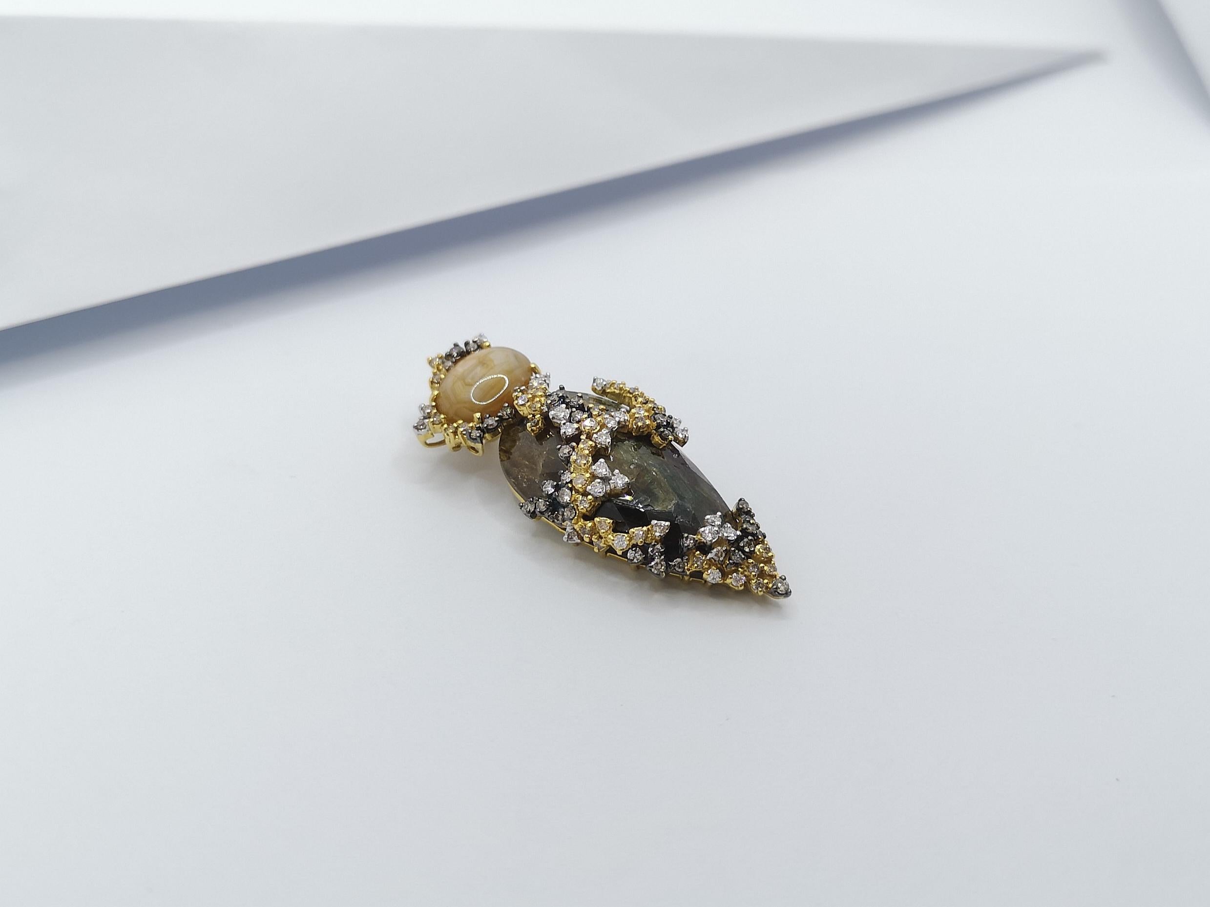 Contemporary Rough Sapphire, Yellow Star Sapphire, Brown Diamond Pendant Set in 18 Karat Gold For Sale