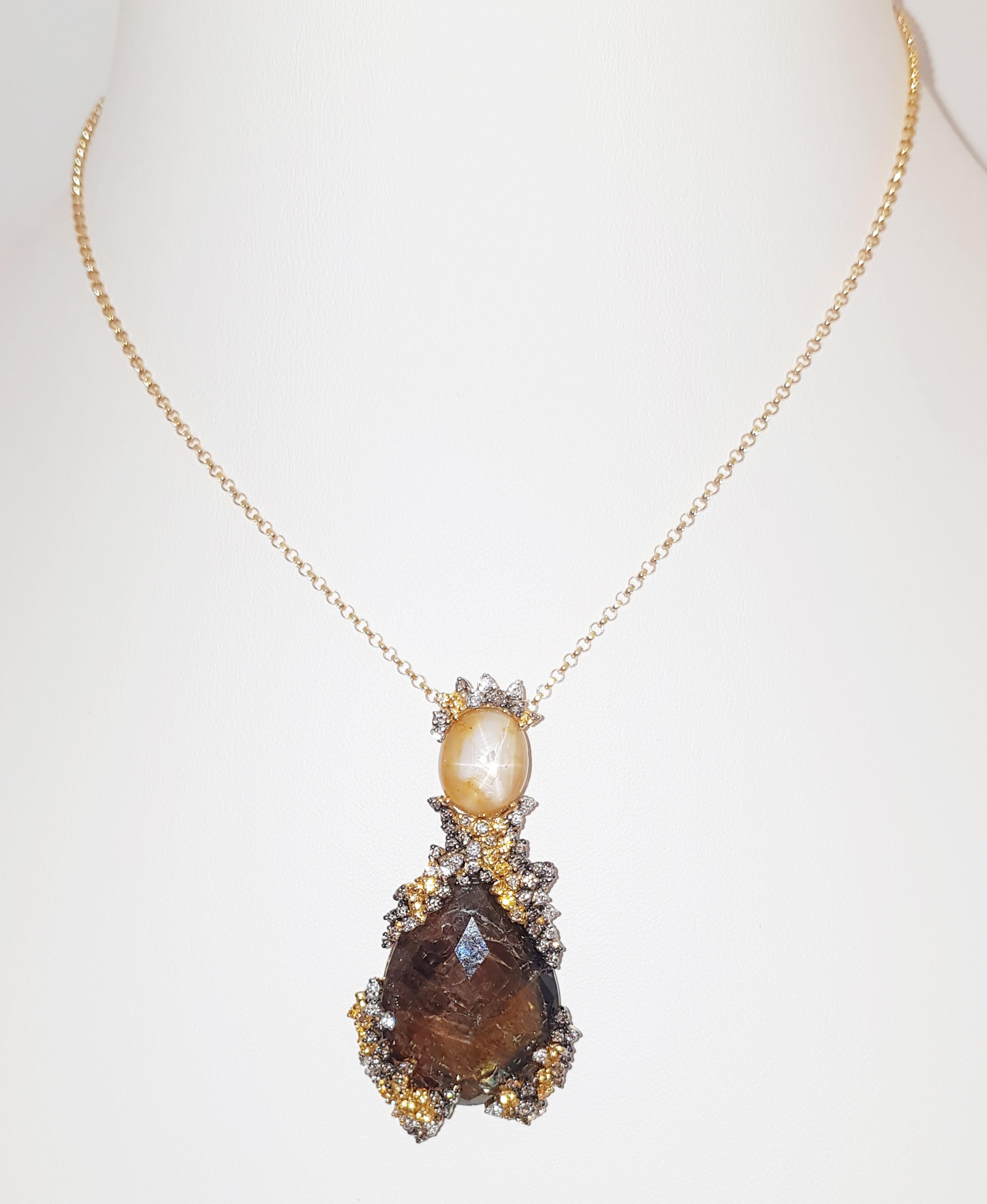 Rough Sapphire 49.14 carats, Yellow Star Sapphire 11.22 carats, Yellow Sapphire 0.46 carat, Brown Diamond 0.88 and Diamond 0.29 carat Pendant set in 18 Karat Gold Settings
(chain not included)

Width: 2.8 cm 
Length: 5.7 cm
Total Weight: 21.92