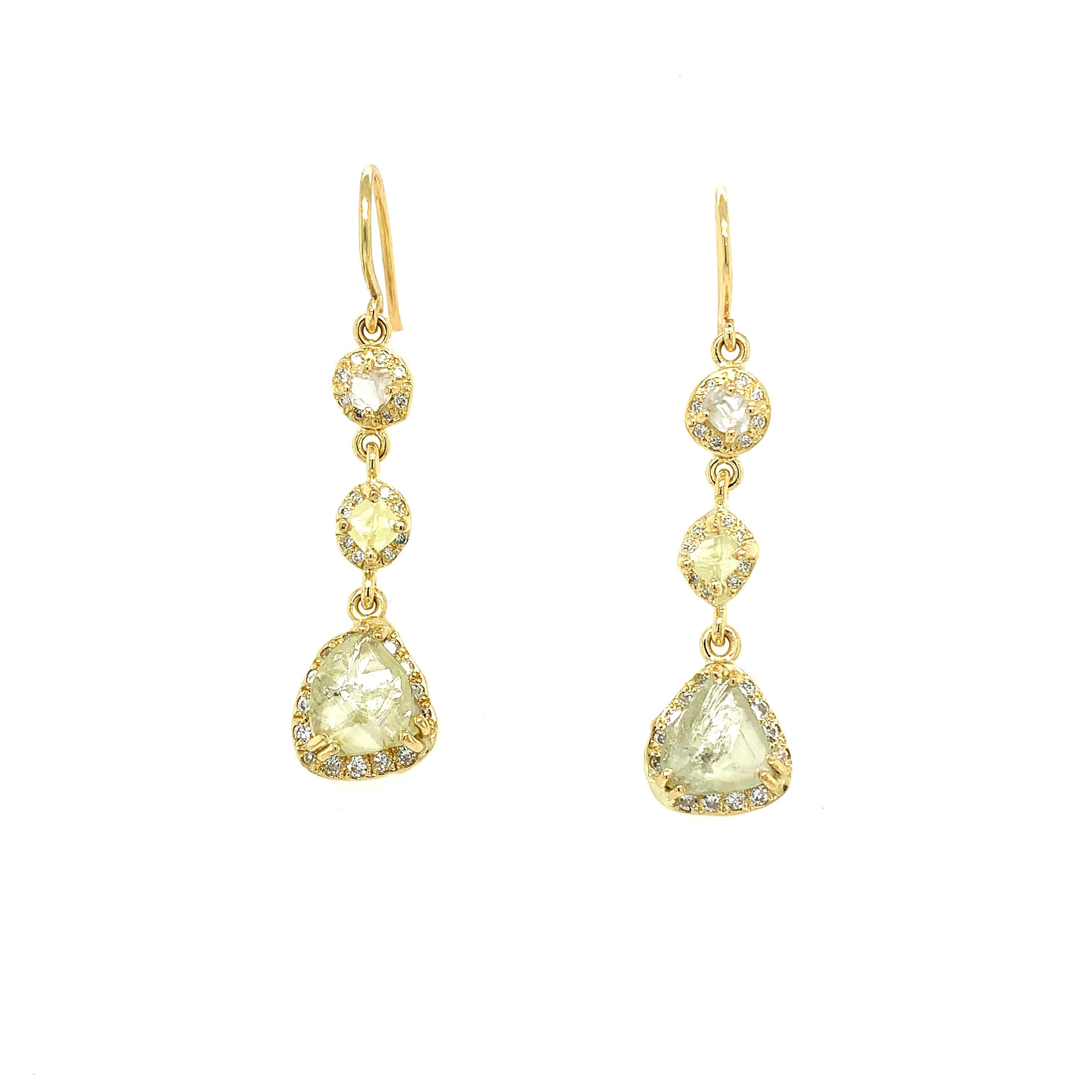 Elevate your jewellery collection with these 5.50ct fancy yellow diamond exquisite bespoke 18k yellow gold drop earrings. The art deco design features rough fancy yellow diamonds that exude a unique charm. The white diamonds set in the metal add a