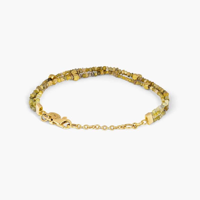 Rough yellow diamond bracelet with 18k gold

This bracelet comprimising of stunning yellow, blue or grey rough diamonds (sourced from Africa), each with a unique cube shape, combined with 18K gold beads. This jewellery has been finished with an 18K