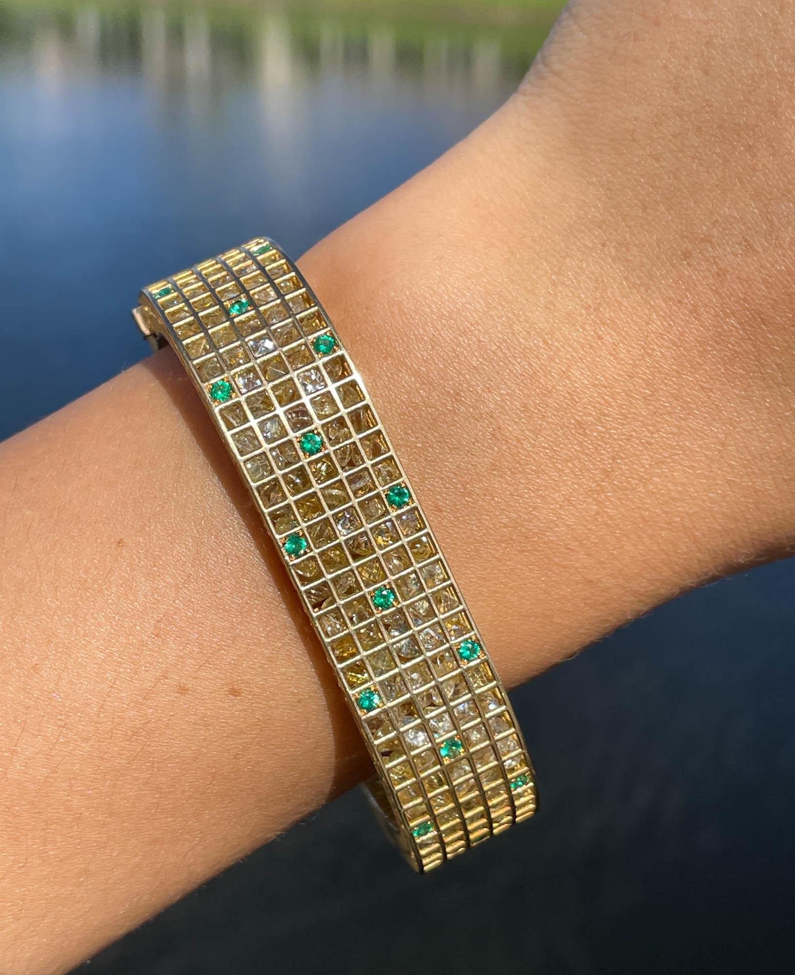 Roule & Company 18k Yellow Gold Yellow Sapphire Emerald and Diamond Pixel Dust Bracelet 
Total carat weight: 91.05ctw Yellow Sapphires; 0.97ctw Green Emeralds and 0.15ctw Diamonds.
The bracelet is 14.24mm wide and fit size 7 inches. The total weight