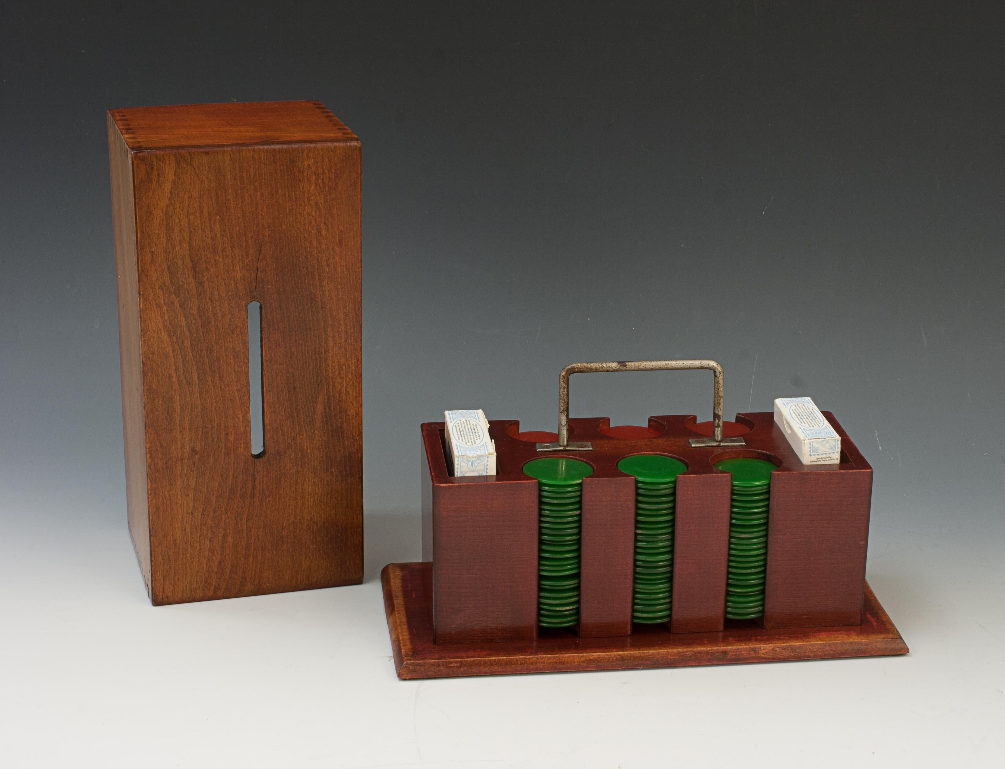 Vintage Gaming Chips, Cards and Container.
A nice set of gambling counters (poker, gambling, gaming chips) and two decks of cards in a rectangular beech-wood keeper with chrome central carry handle and a lift off lid. The carrier contains six