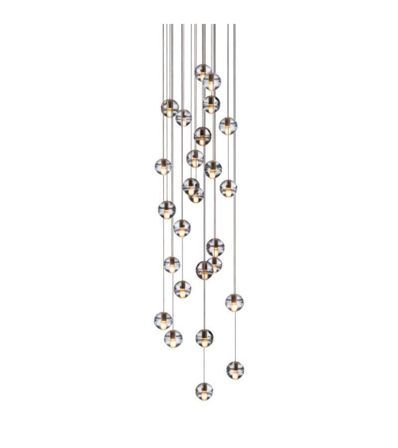 Round 14.26 Chandelier lamp by Bocci
Dimensions: Diameter 60 x Height 300 cm 
Materials: Brushed Nickel, Cast glass, blown borosilicate glass, braided metal coaxial cable, electrical components, white powder-coated canopy.
Available in