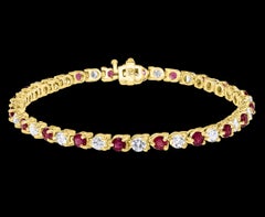 Round 2 Carat Diamond and 2 Carat Ruby Line Tennis Bracelet in Yellow Gold