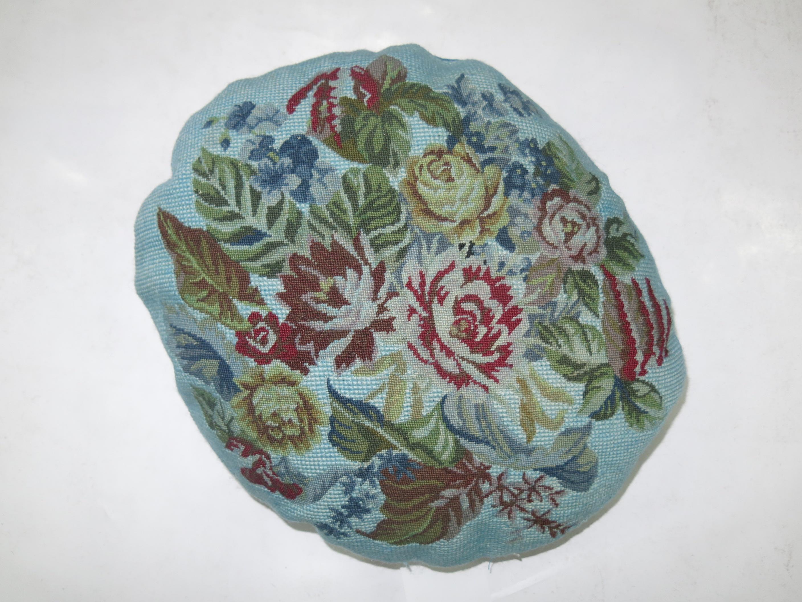 Round pillow made from a 20th century French needlepoint with blue cotton back and zipper closure.

Measures: 12