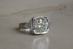 Round 5.10 Carat Solitaire and Trillion Cut Diamond Ring
