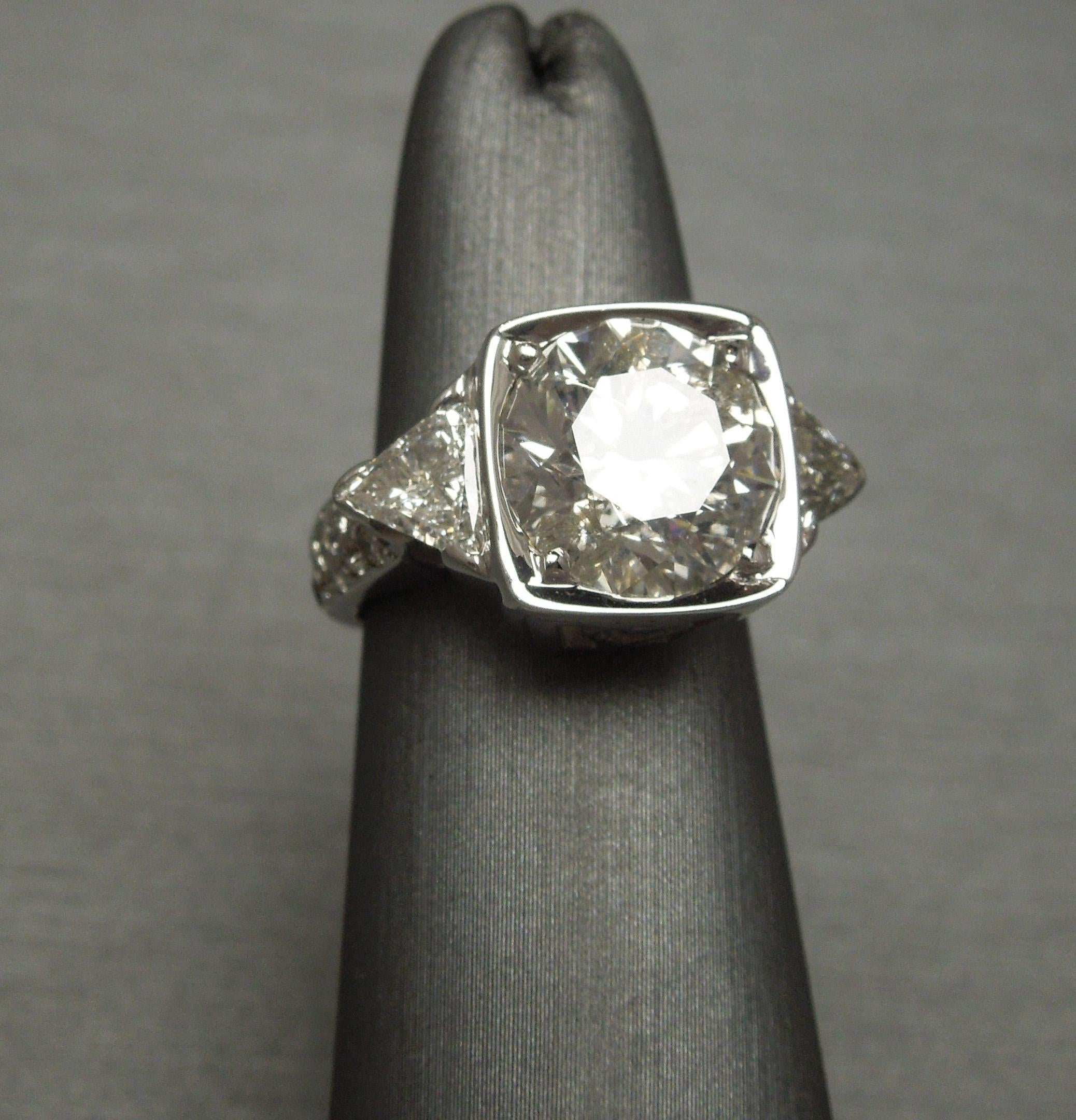 Round 5.10 Carat Solitaire and Trillion Cut Diamond Ring For Sale 1