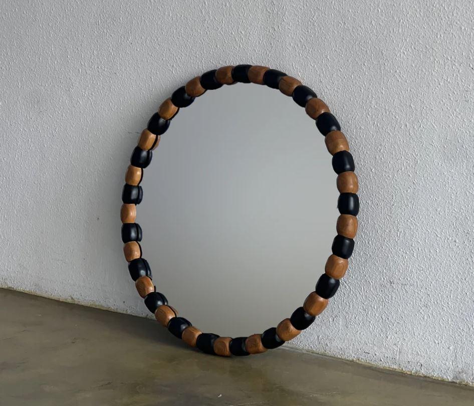 Round 60 Onde Mirror by Studio Kallang
Dimensions: W 5 x D 60 cm
Materials: Solid Teak. 

STUDIO KALLANG IS A SINGAPORE AND SEATTLE BASED PROJECT FOCUSING ON OBJECTS DESIGNED BY FAEZAH SHAHARUDDIN.
PIECES ARE PLAYFUL EXPLORATIONS IN FORM,