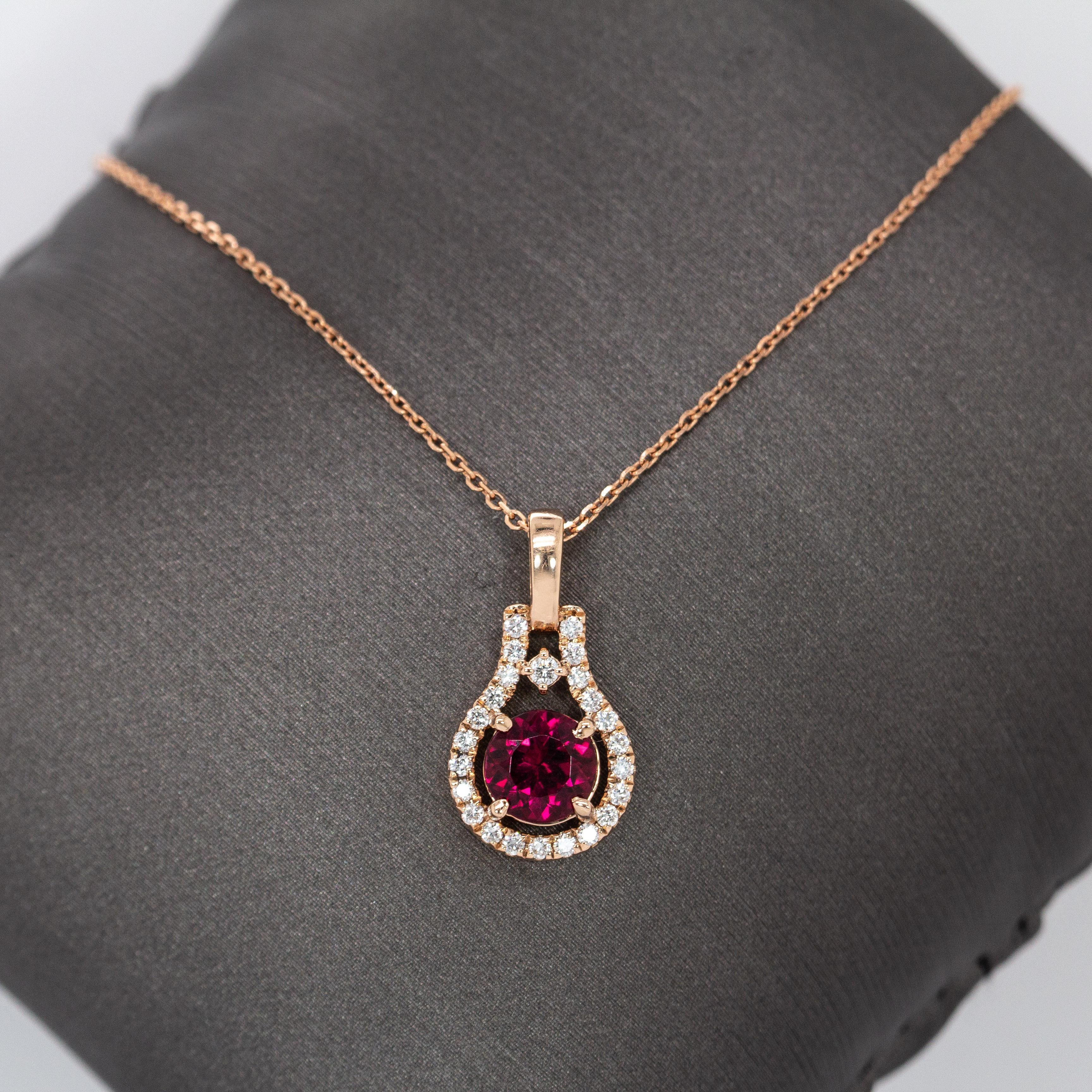 Bold, bright, and born to shine! This round ruby pendant features a passionate pop of red, surrounded by a halo of natural diamonds in solid 14k yellow gold. It’s a fine jewelry favorite for her—ideal as an anniversary gift or a birthday gem for
