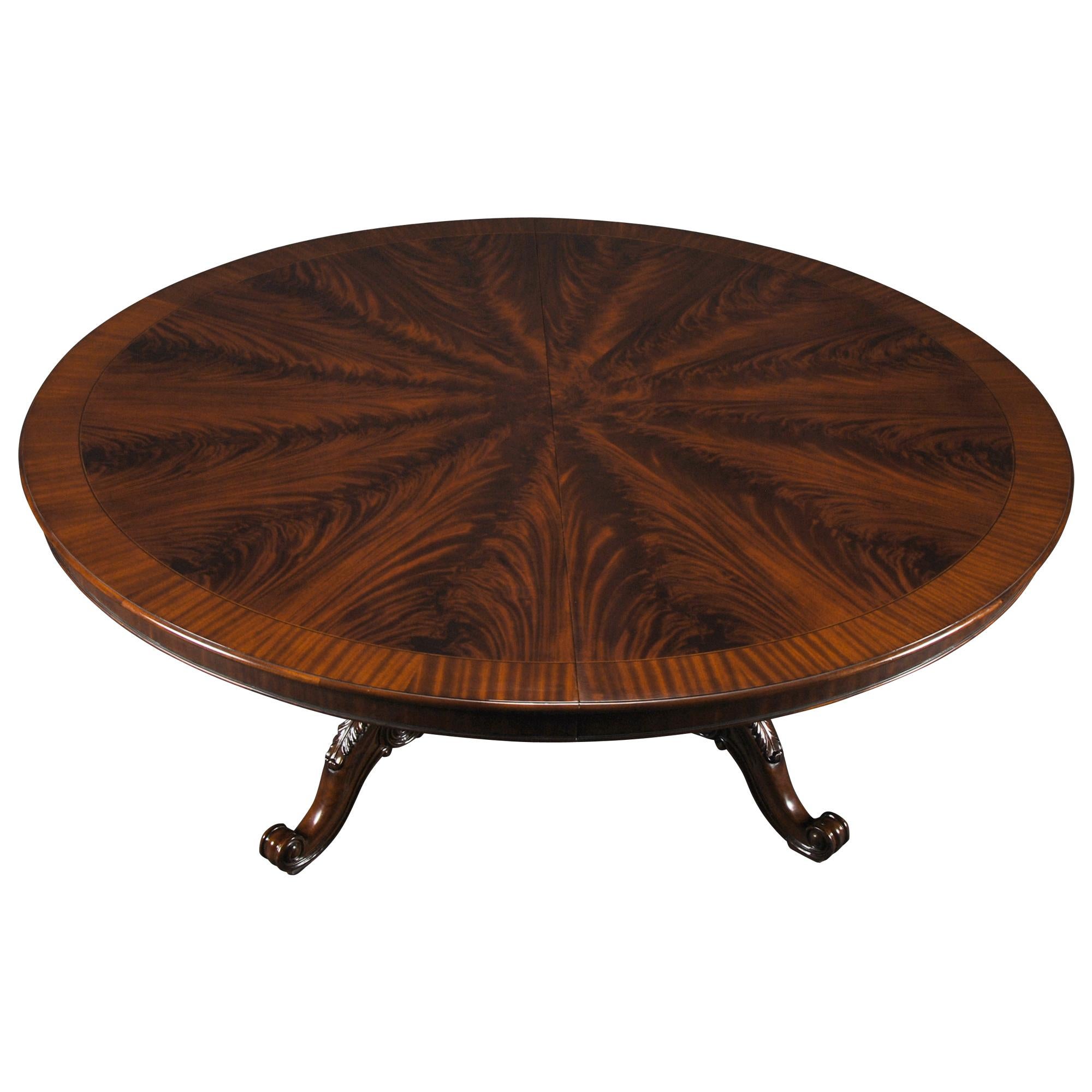 The Round 84 inch Table is finished in medium brown tones and a mahogany banding gives our  table a traditional appearance. This is a high quality dining table with a smooth polished top over the field of finely figured mahogany.  The top of the