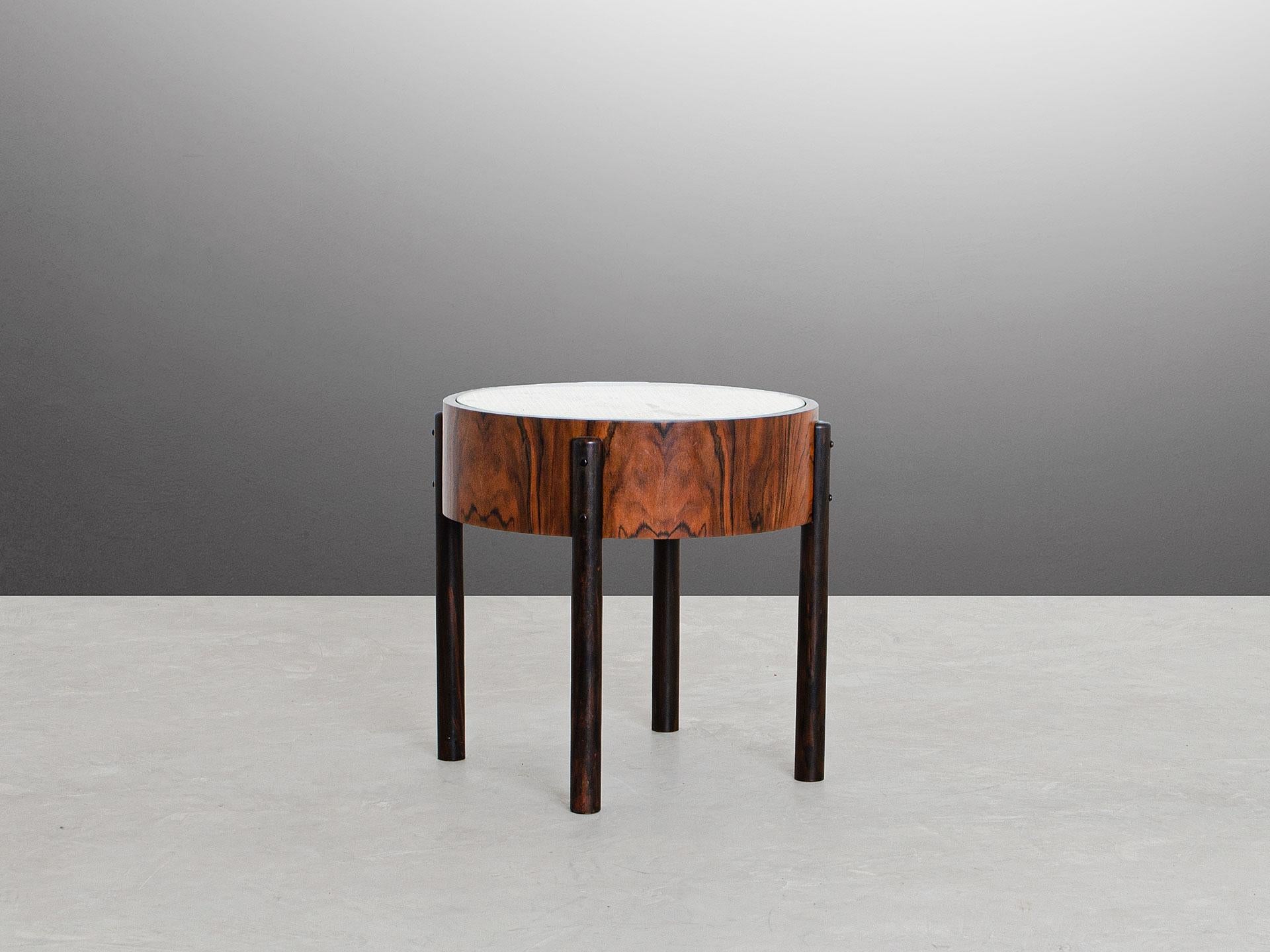 The round Adi table is a 60's-inspired side table and it was started to be produced in 2019. 
The simple lines from the minimalistic design combined with the roughness of the materials together bring a very special quality to the piece, that