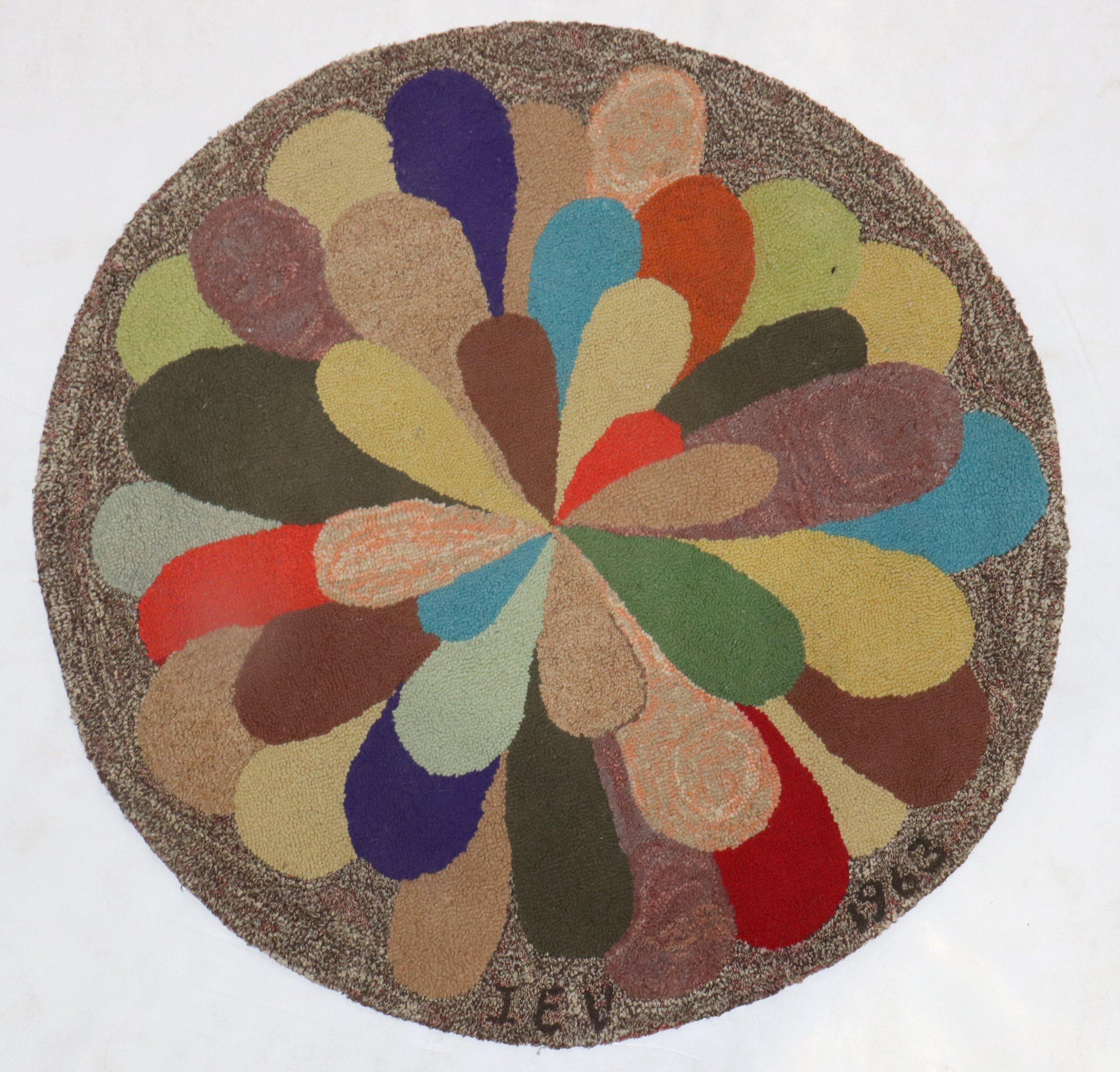 Rare American Hooked rug with a happy colorful motif. Dated 1963 and initialized IEV. Not sure whose name is in the initials

Measure: 30'' round.