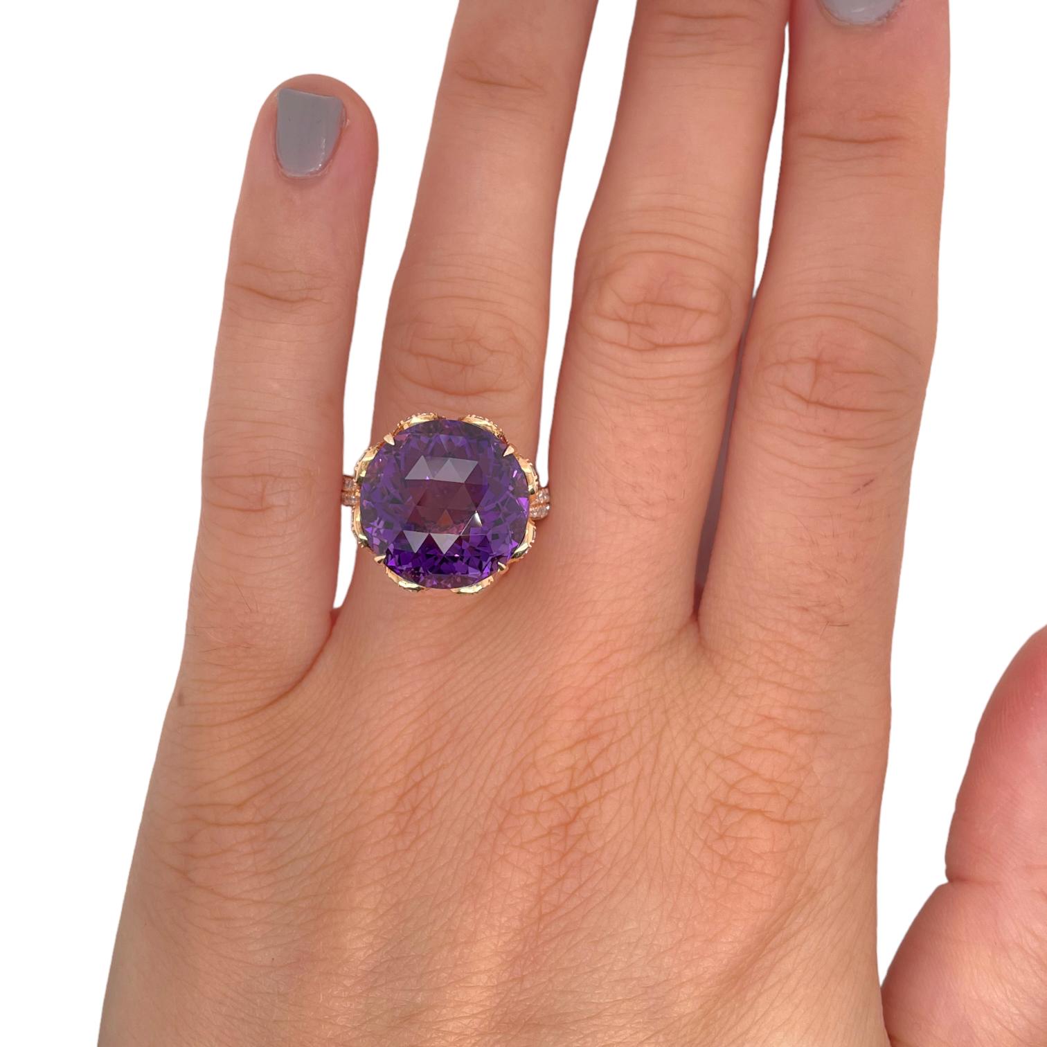 Ring contains one center round checkerboard cut amethyst, 13.43ct. Center stone is accented by round brilliant diamonds, 0.63tcw. Diamonds are colorless and VS2 in clarity. 
Ring can be resized to desired measurement. Please request