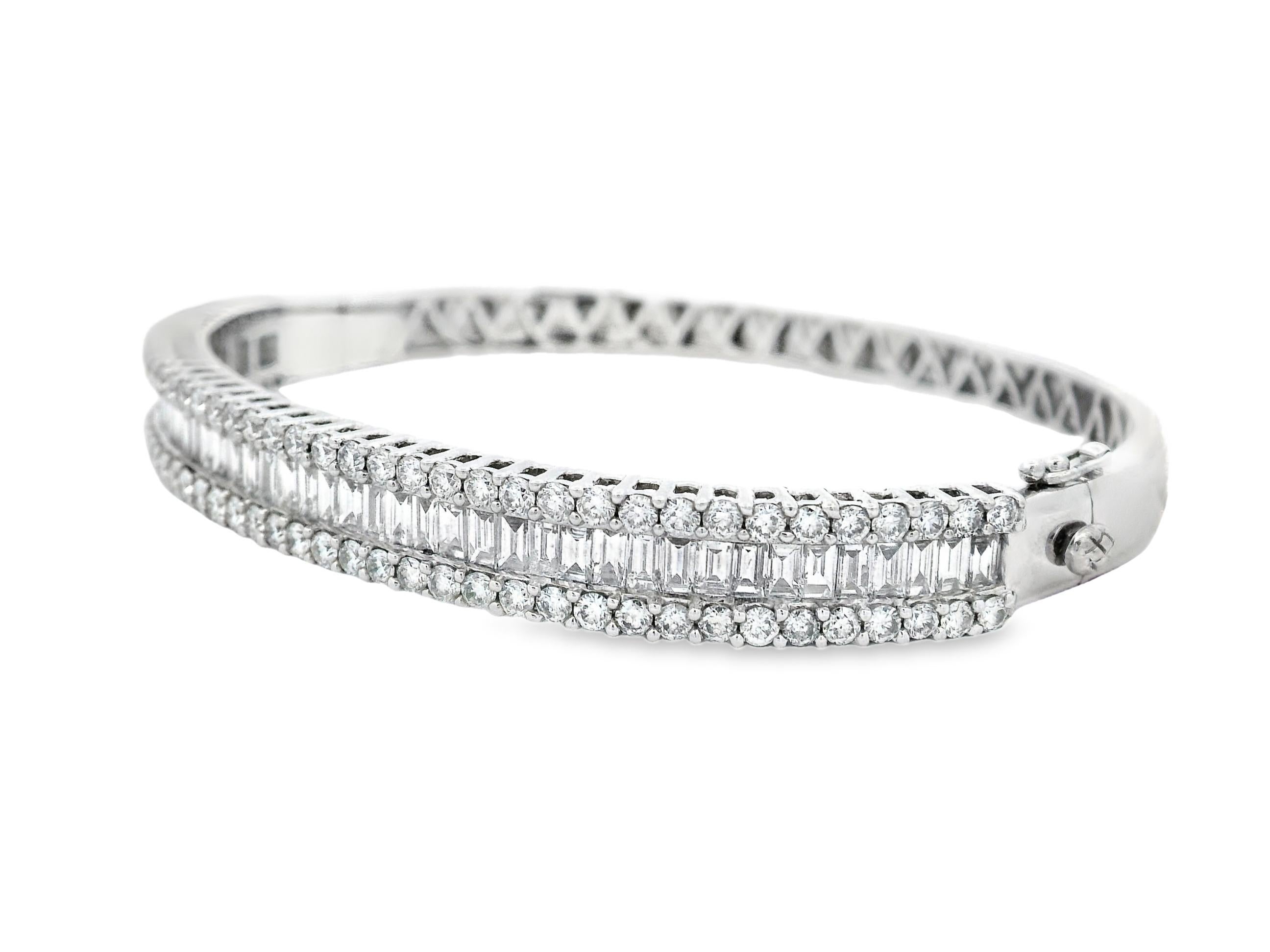 This exceptional diamond bangle showcases an elegant blend of round and baguette-cut diamonds totaling approximately 4.50 carats. Forty-five baguette diamonds (2.40 carats) form a seamless central row, framed by two lines of eighty-two round