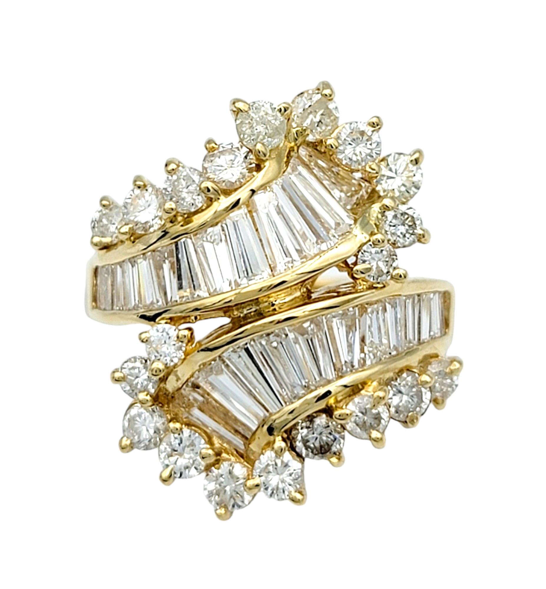 Ring Size: 5.25

This captivating diamond ring crafted in lustrous 14 karat yellow gold embodies understated elegance with a touch of modern flair. Mimicking the graceful movement of a bypass design, the ring features a mesmerizing arrangement of