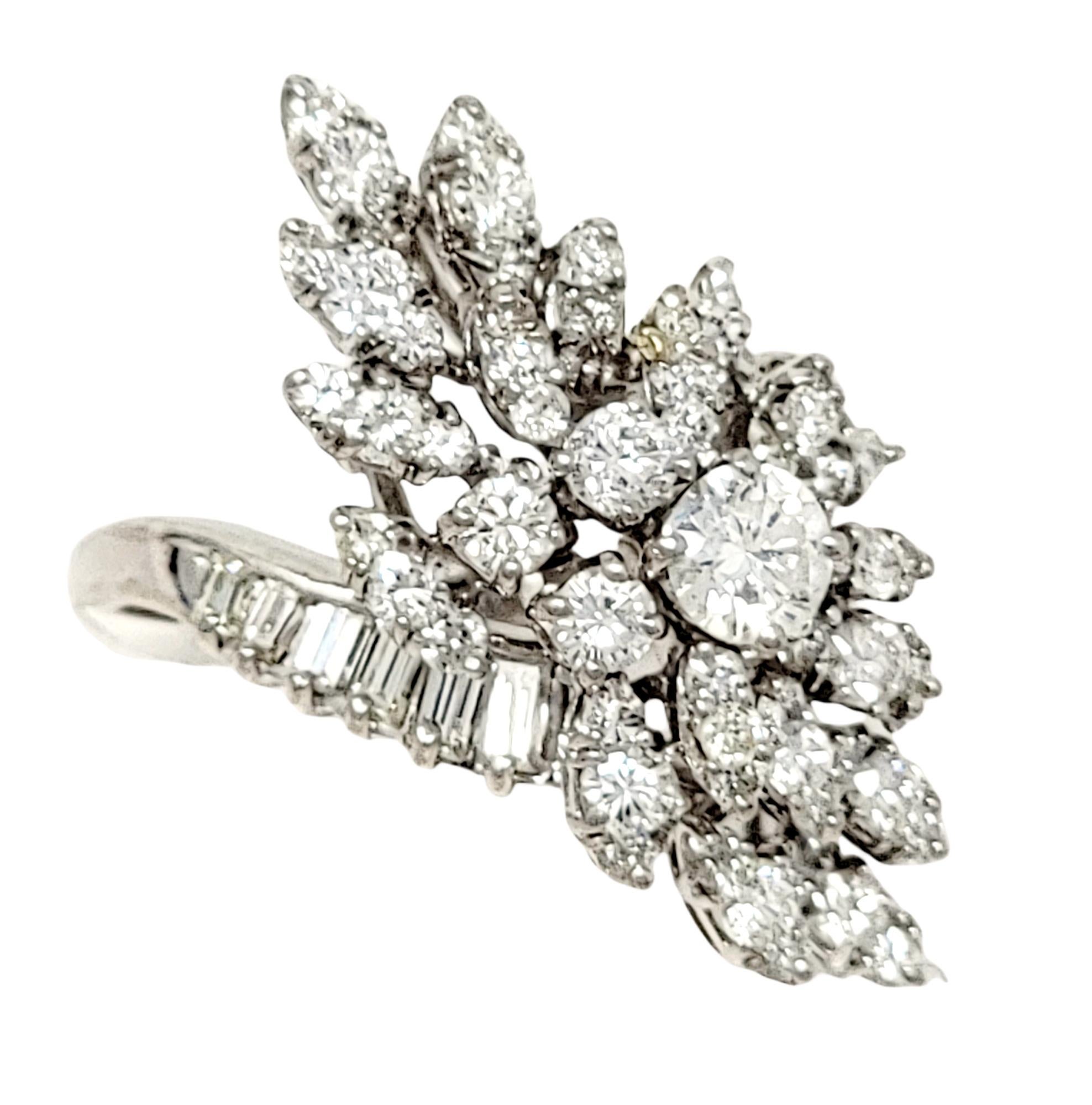 Ring size: 6

Unique diamond cluster ring with diagonal layout. This gorgeous piece fills the finger with sparkle from end to end and shimmers beautifully in the light. The white gold setting makes the already stunning diamonds appear even more