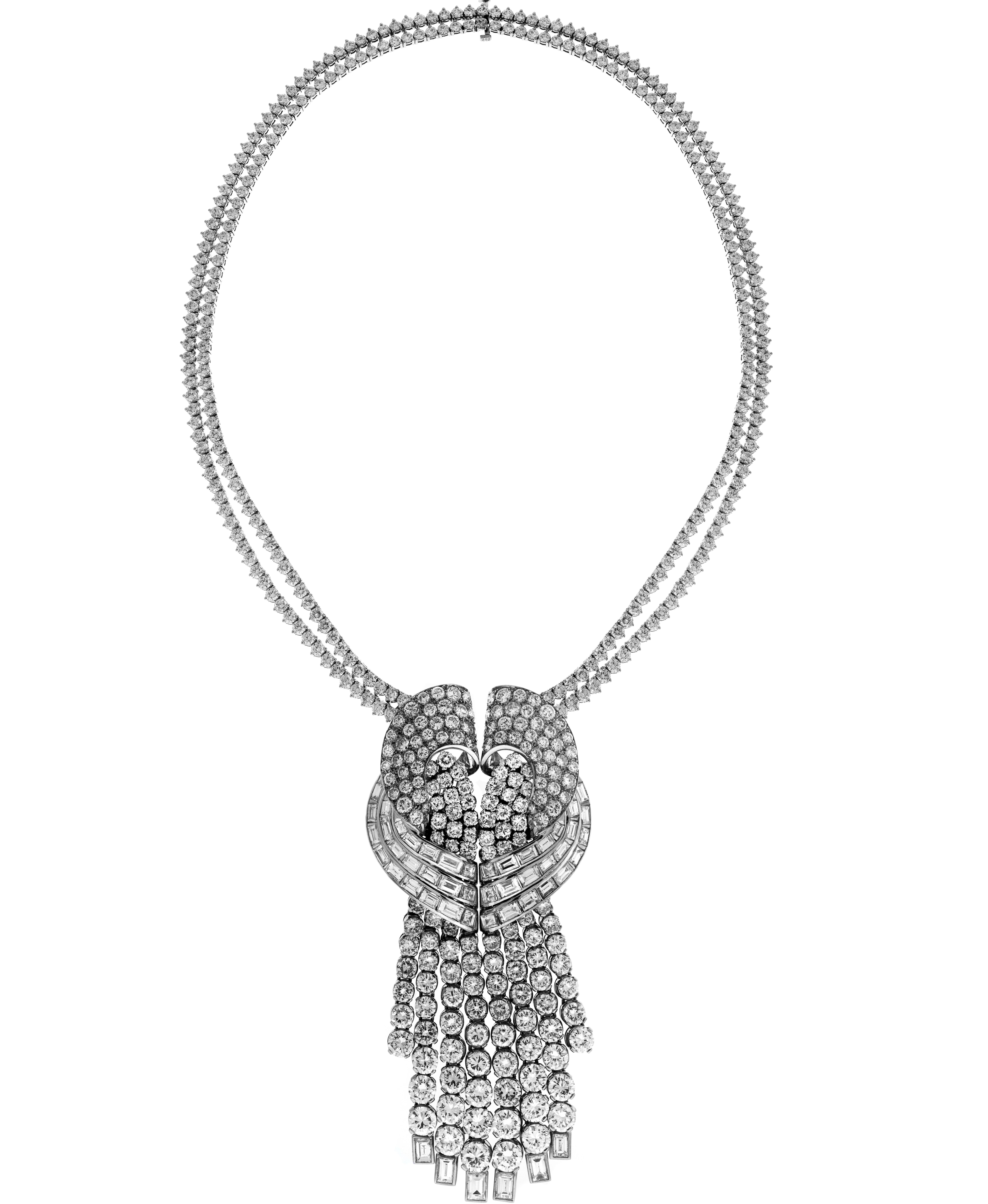 Platinum Large Dangling Baguette Round Diamond Pendant Double Tennis Necklace

Round and Straight Baguette Diamonds are set all throughout the pendant. Pendant is attached to two tennis necklaces.

Total weight of diamonds: Apprx. 53.81 carat all
