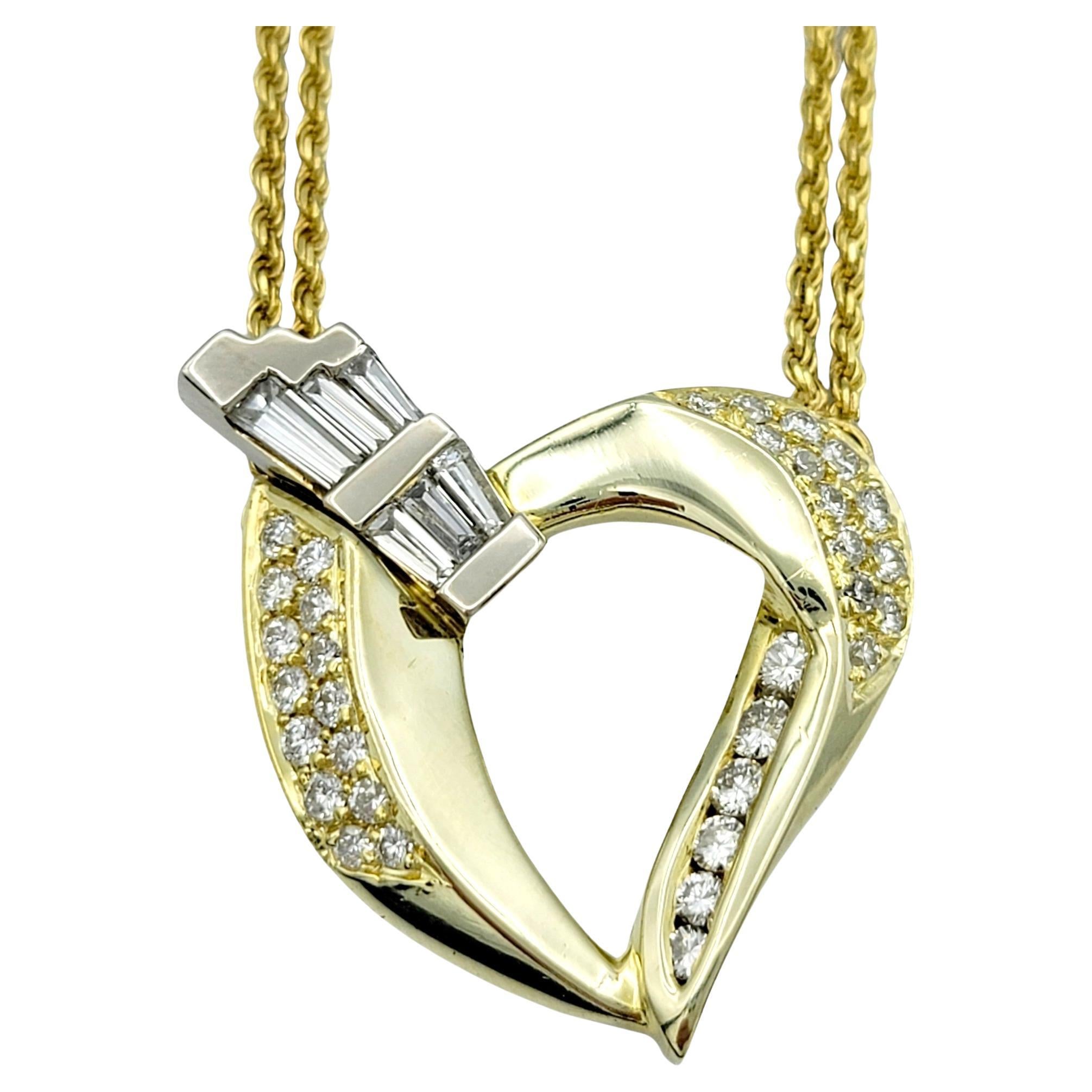 This 14 karat yellow gold necklace is a striking testament to elegance and glamour. Its centerpiece is a stationary open heart pendant, a symbol of enduring love and boundless affection. The pendant is adorned with a dazzling array of round and