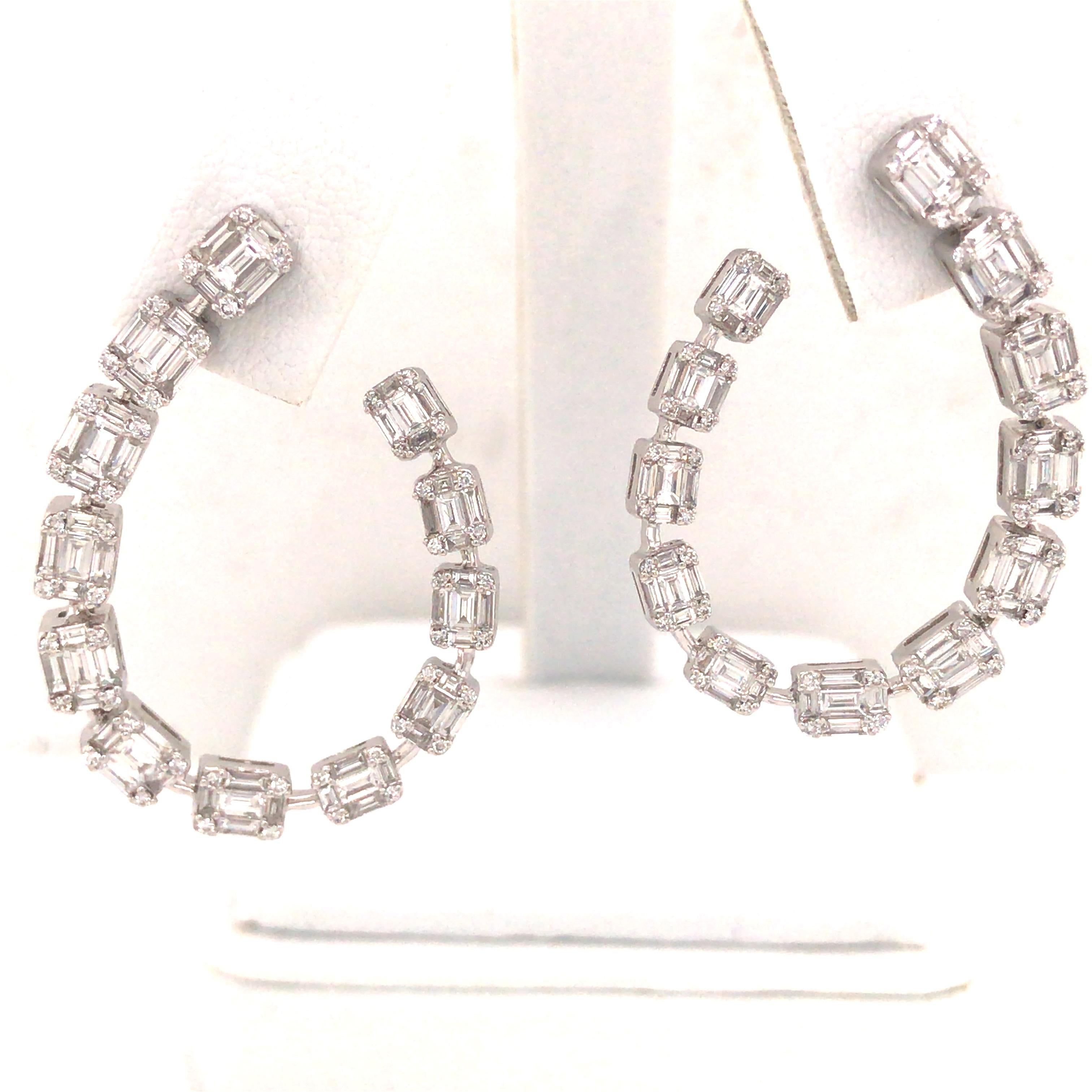 Round and Baguette Diamond Open Hoop Earring in 18K White Gold.  Round Brilliant Cut and Baguette Diamonds weighing 2.73 carat total weight, G-H in color and VS-SI in clarity are expertly set.  The Earrings measure 1 3/8 inch in length and 1 inch in