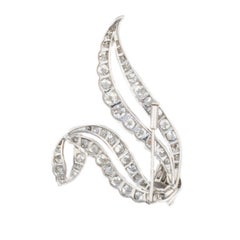 Round and Baguette Diamond Ribbon Brooch in Platinum
