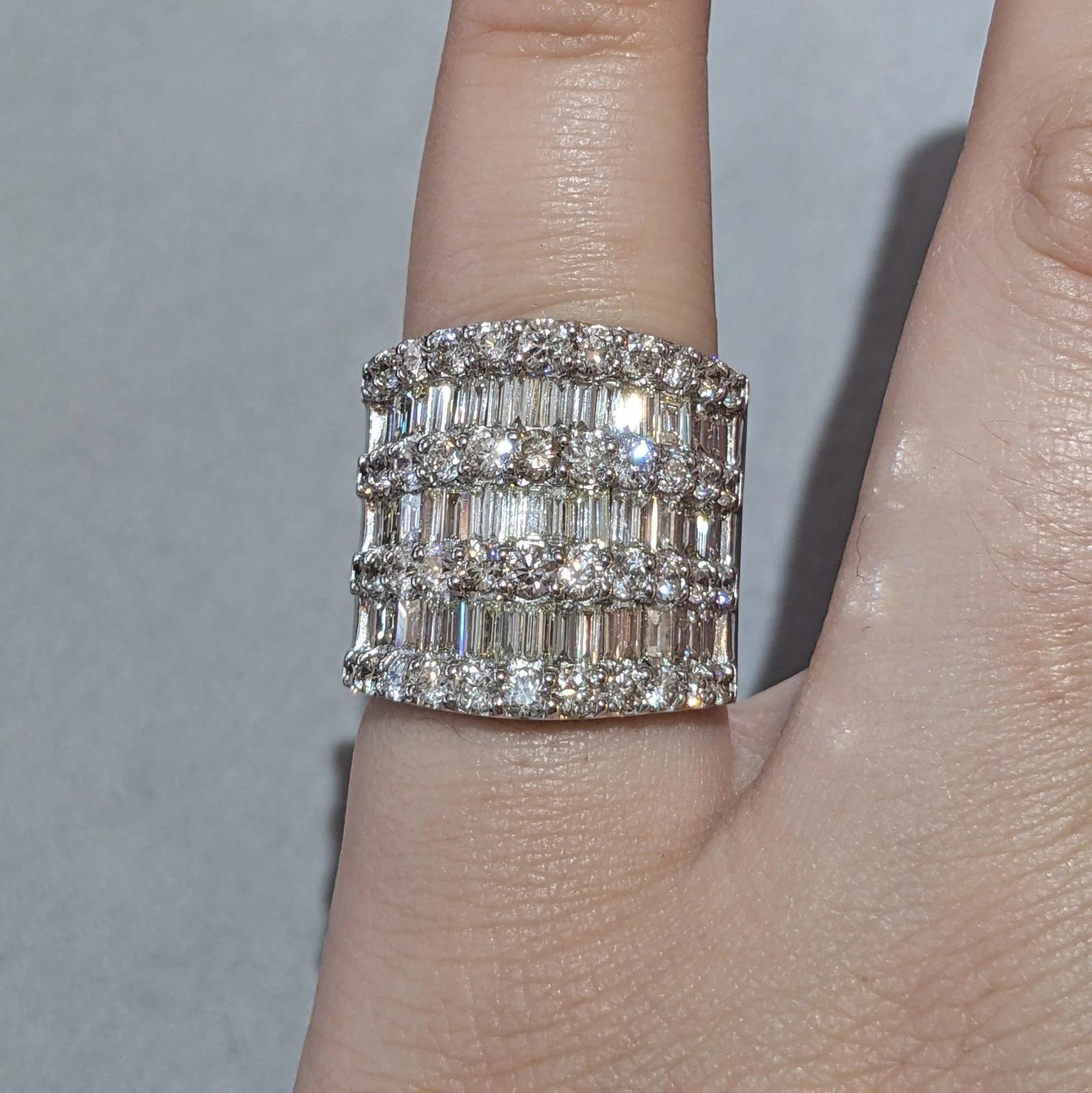 Baguette and Round Diamond Wide Ring 5.00 cttw in Platinum

Wide Diamond Band Ring features four rows of Round Brilliant Diamonds and 3 rows of channel set Baguette Diamonds, all set in Platinum in an extra wide band design.

Total diamond weight is