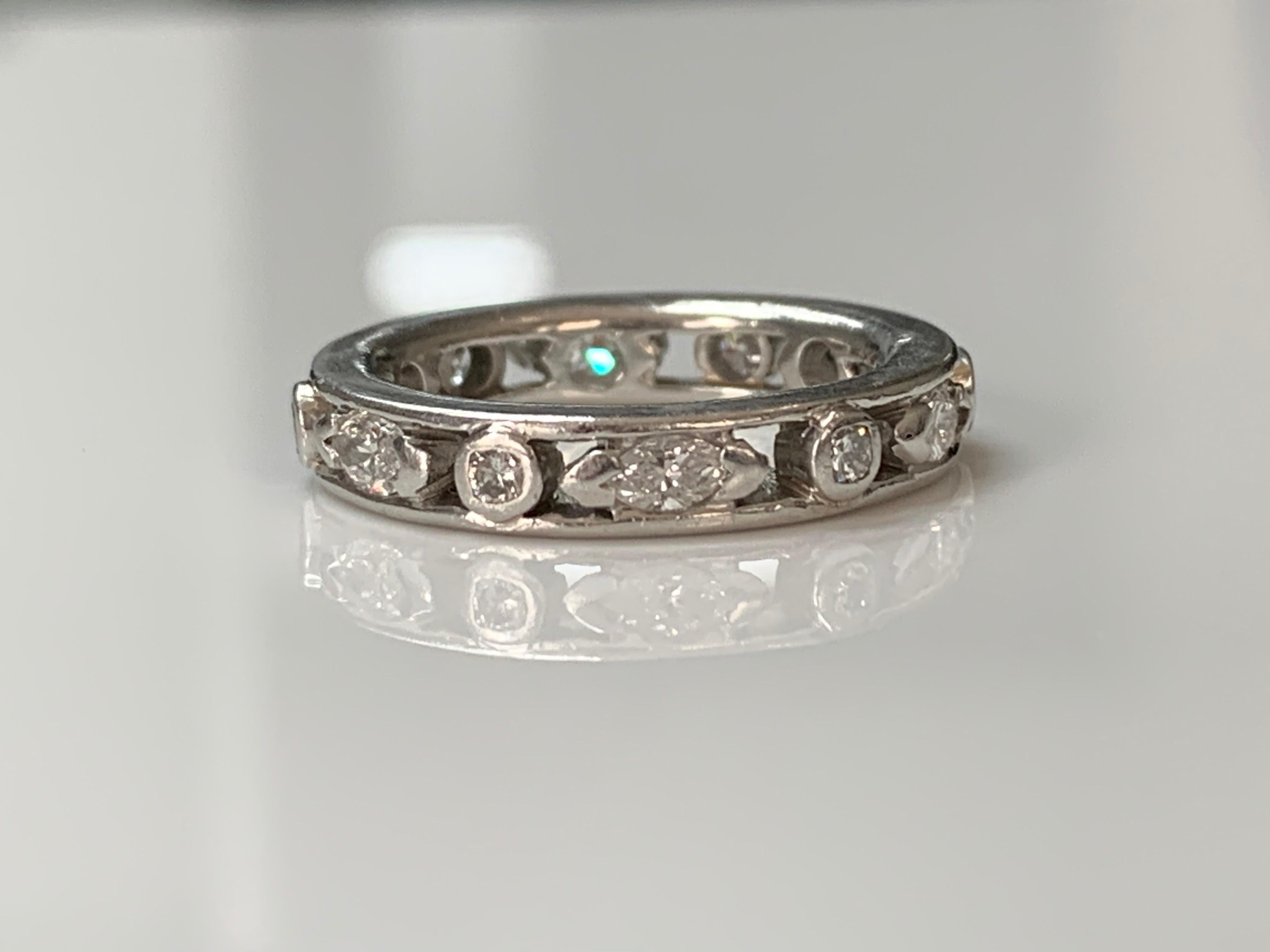 Unique Round and marquise diamond eternity band beautifully hand made in platinum. 
The details are as follows : 
Diamond weight : 0.90 carat ( GH color and VS clarity ) 
Metal : Platinum 
Ring size : 6 
