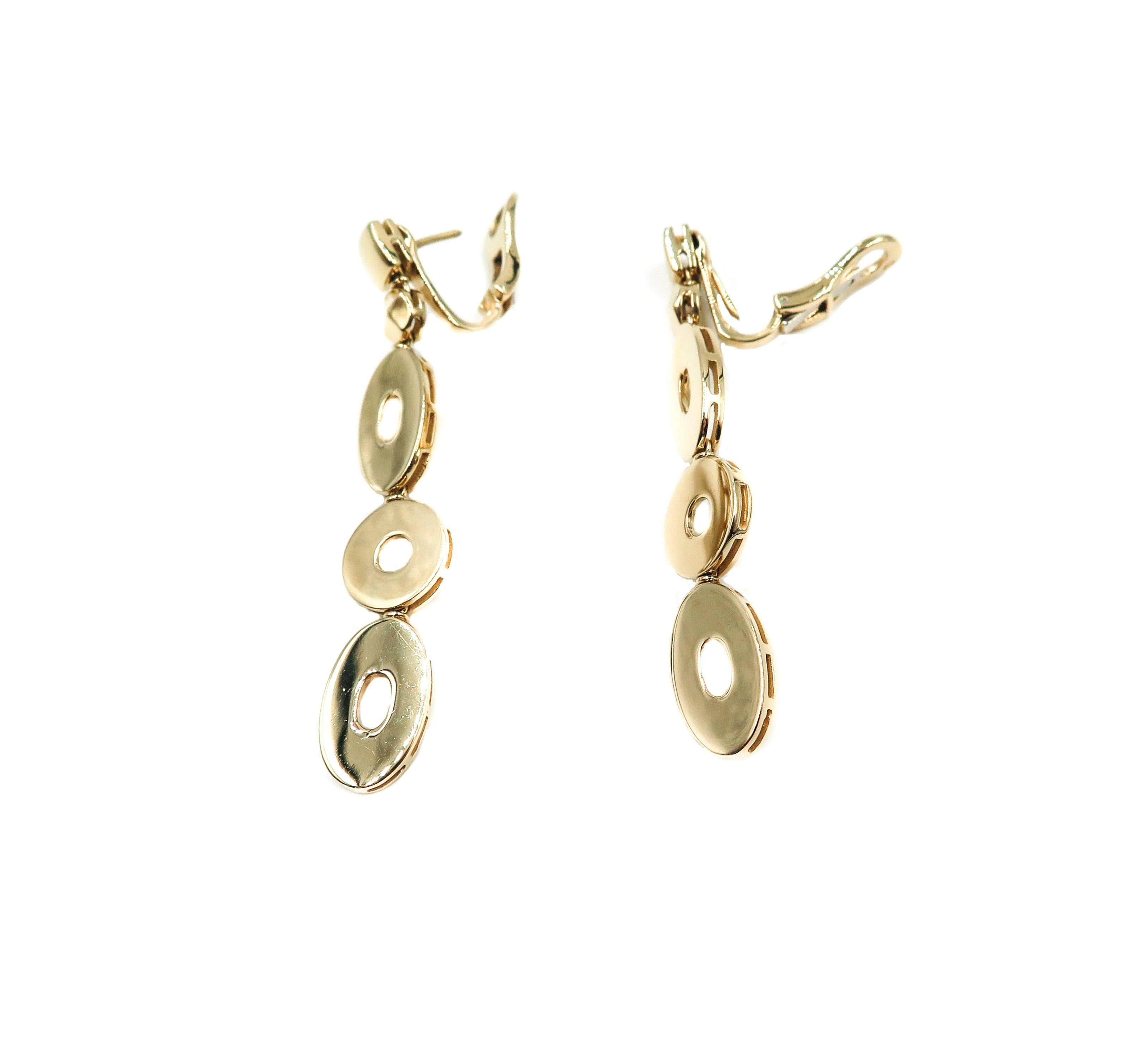 Absolutely beautiful, these earrings can be worn everyday and with everything!
Clean and tailored look to complement any outfit... great to wear casual with jeans or dress it up. 
Crafted in 18k yellow gold with a high polished and a clip earring